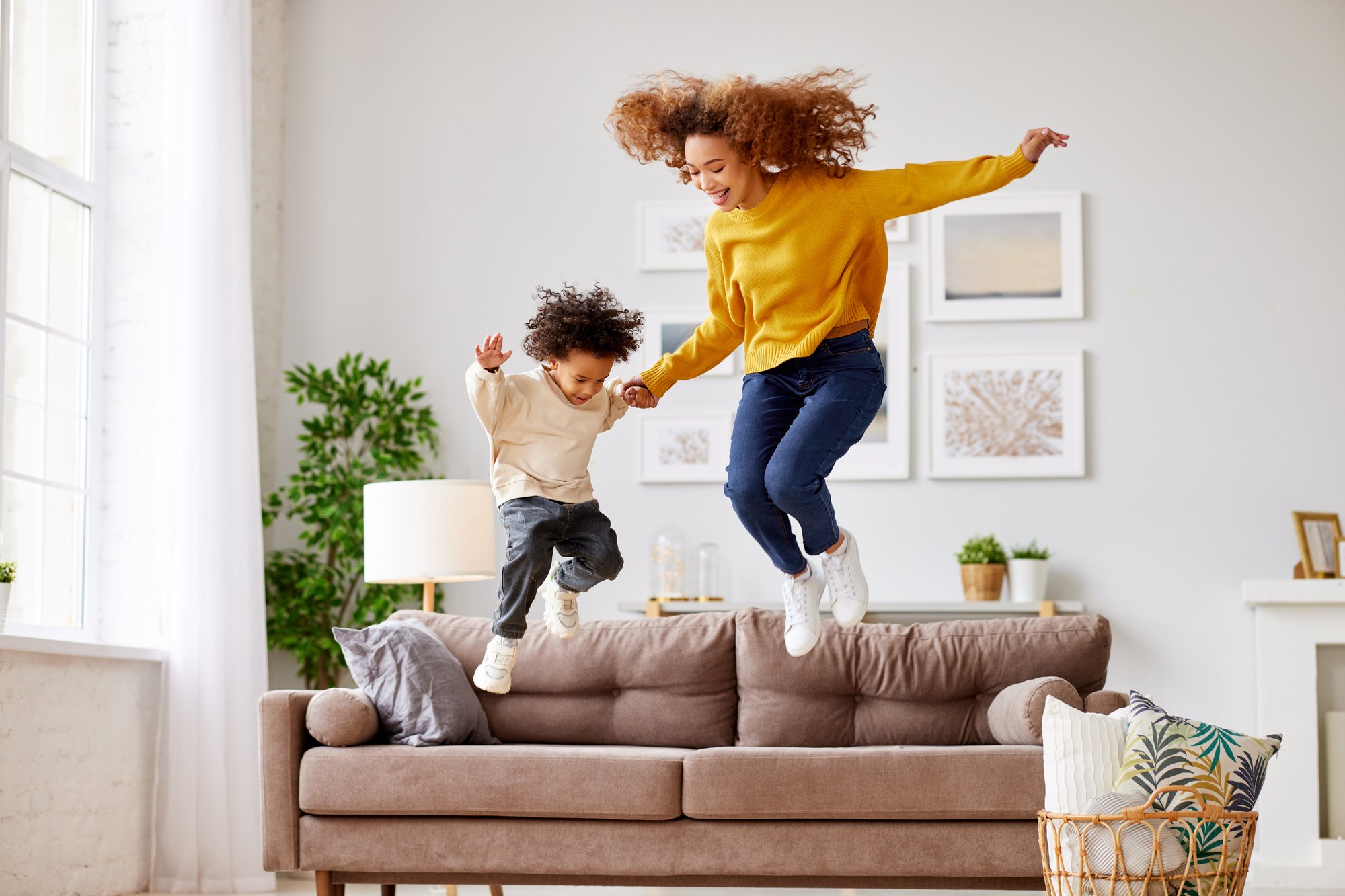 people jumping on couch