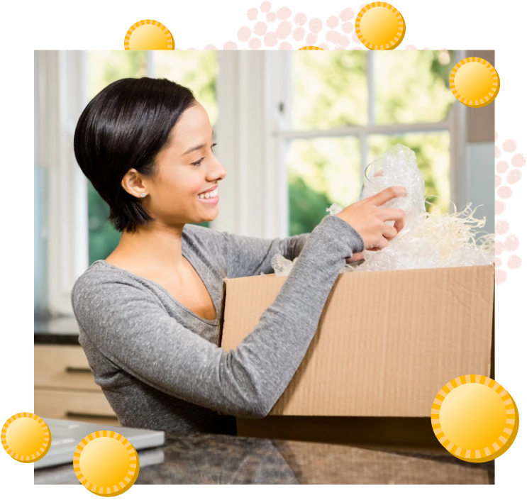 smiling woman opening a package 