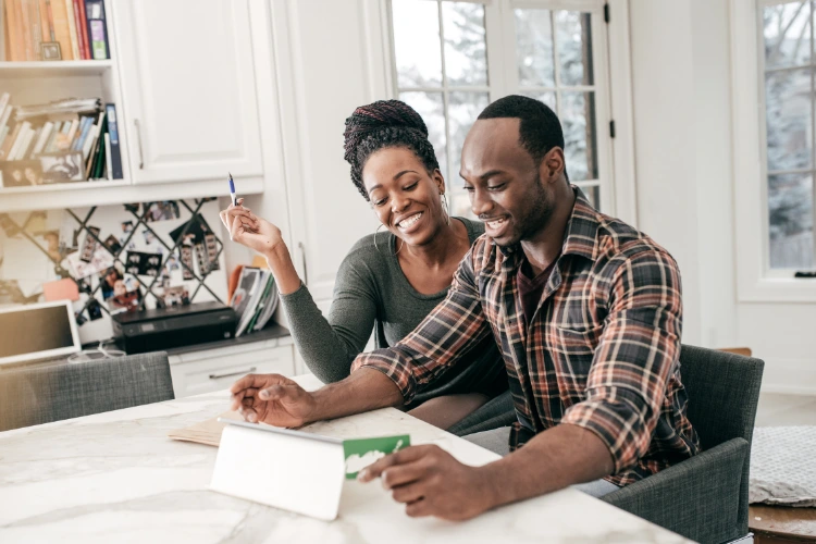 Two people using a computer