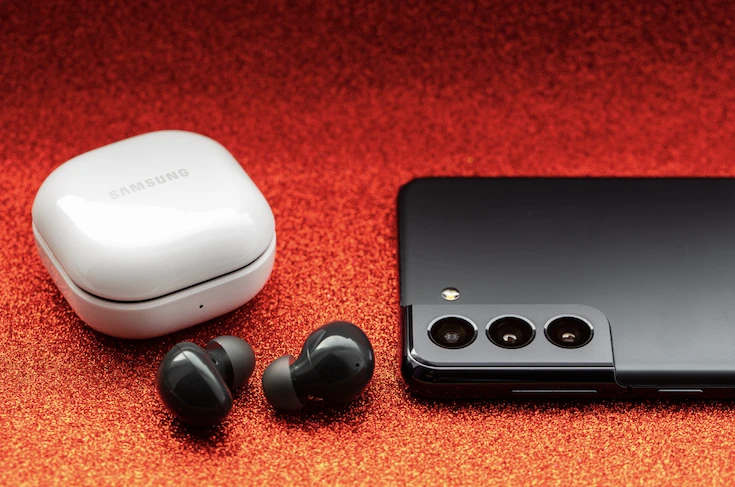 earbuds , case and smartphone