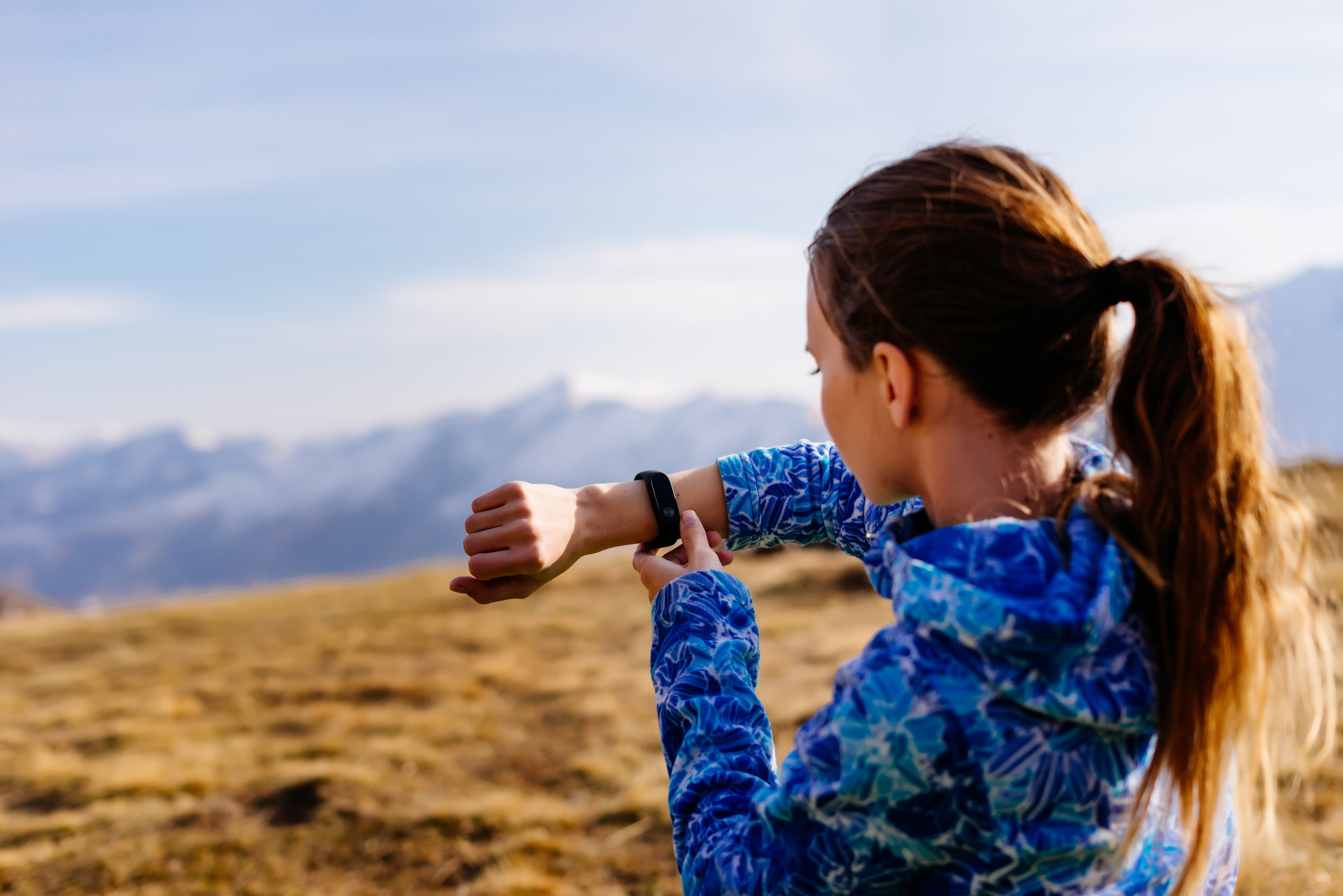 Woman looking at her fitness tracker