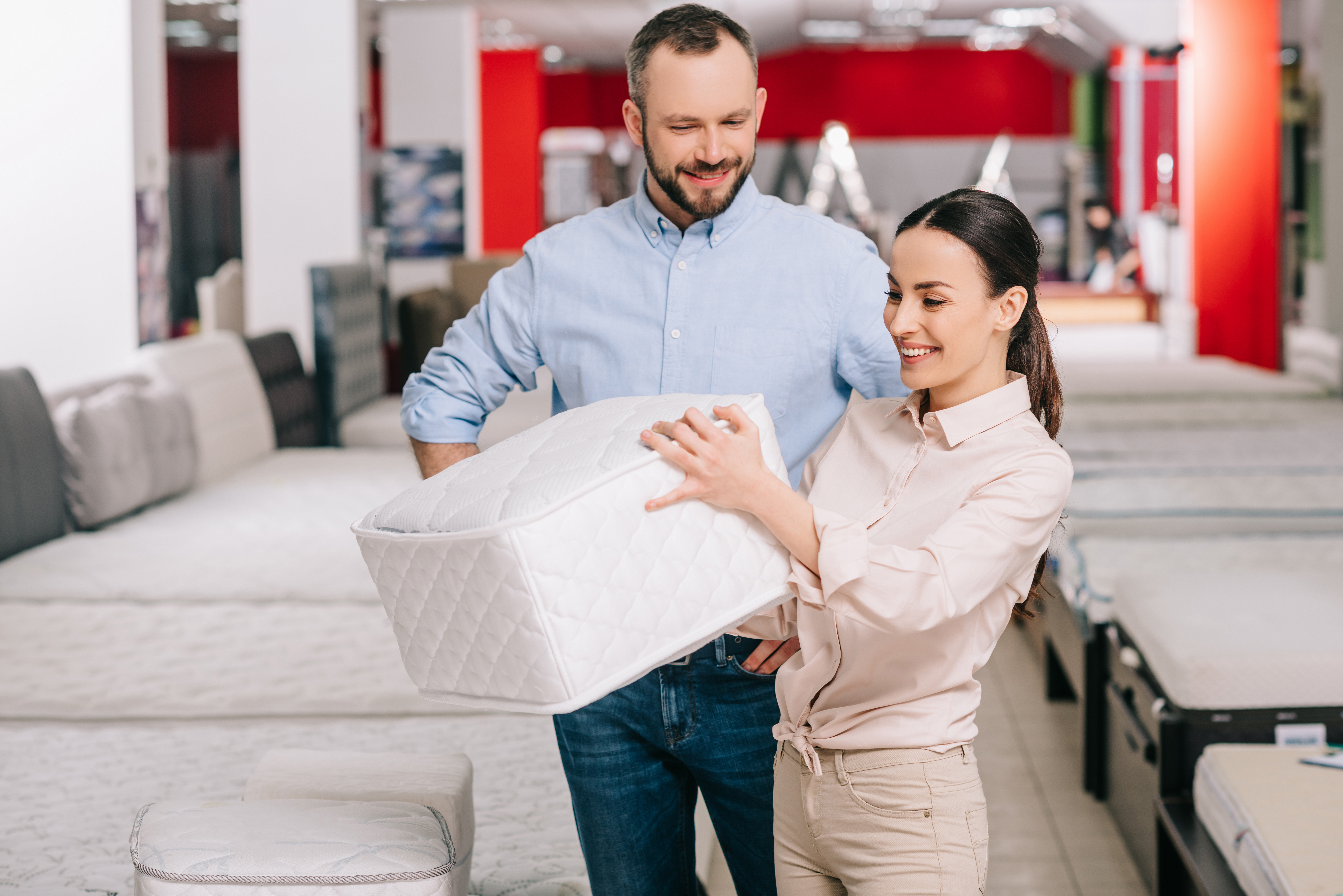 Man and woman shopping for a mattress