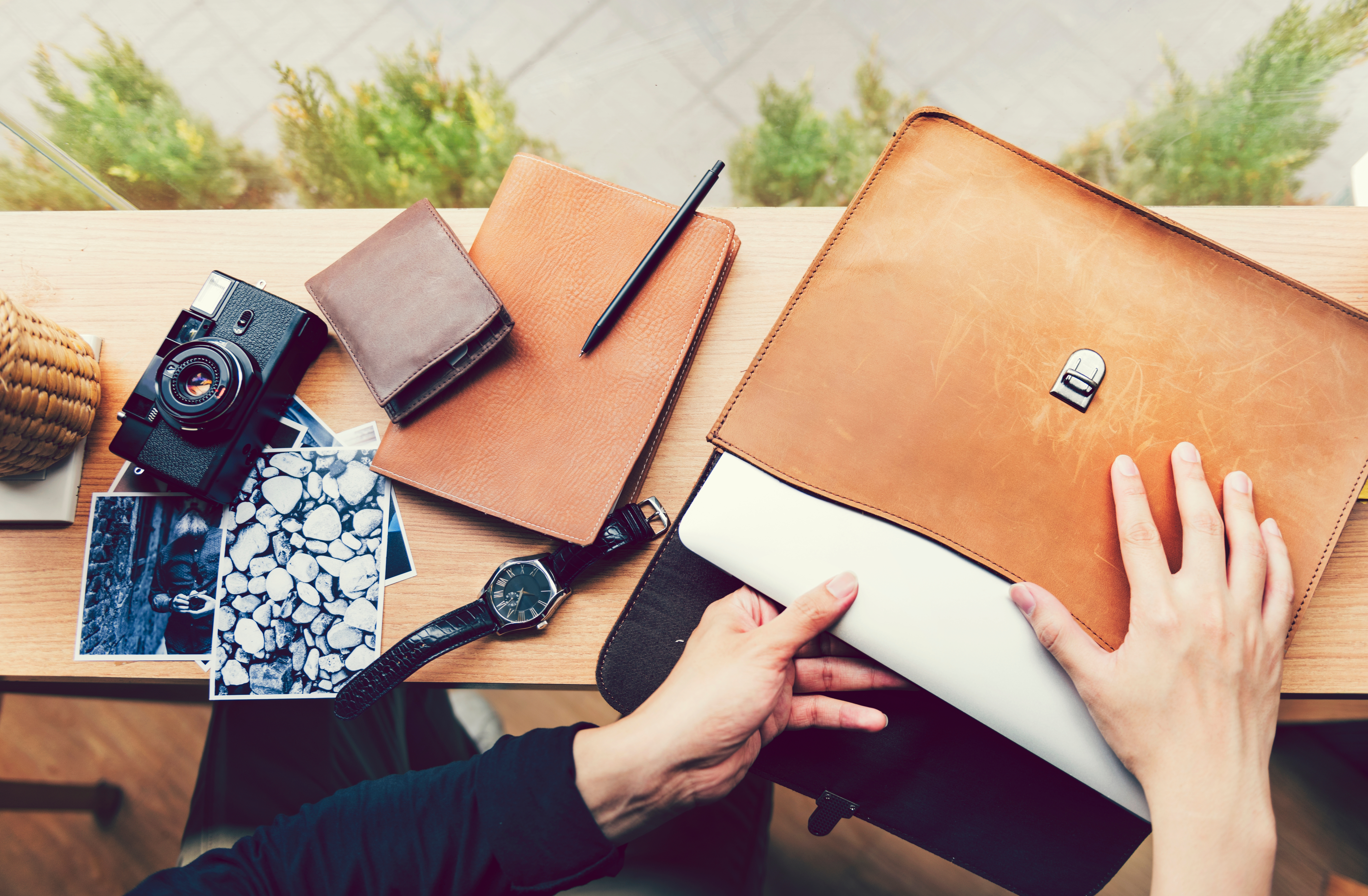 Person putting laptop into laptop sleeve