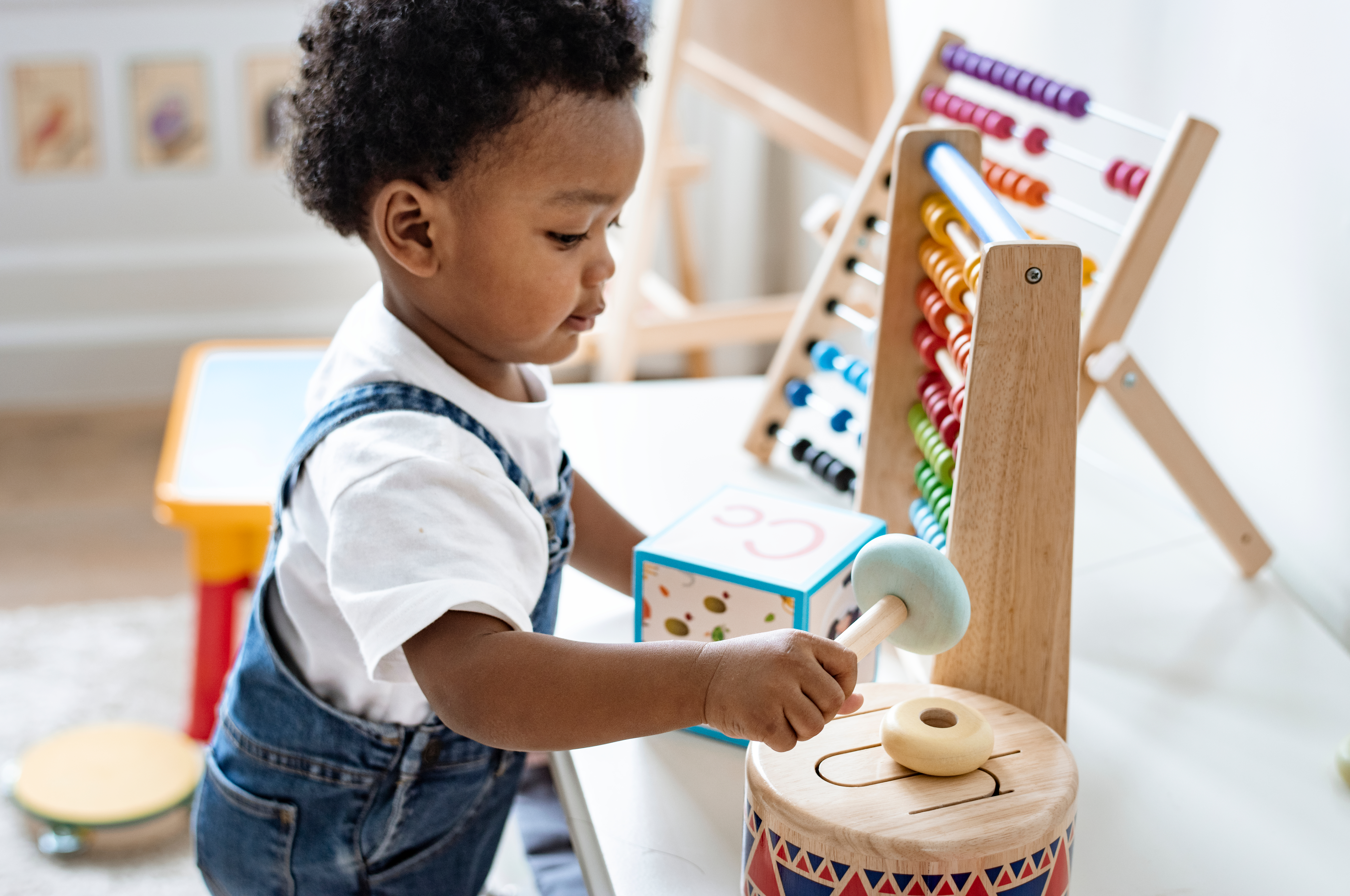 Young kid playing with toys