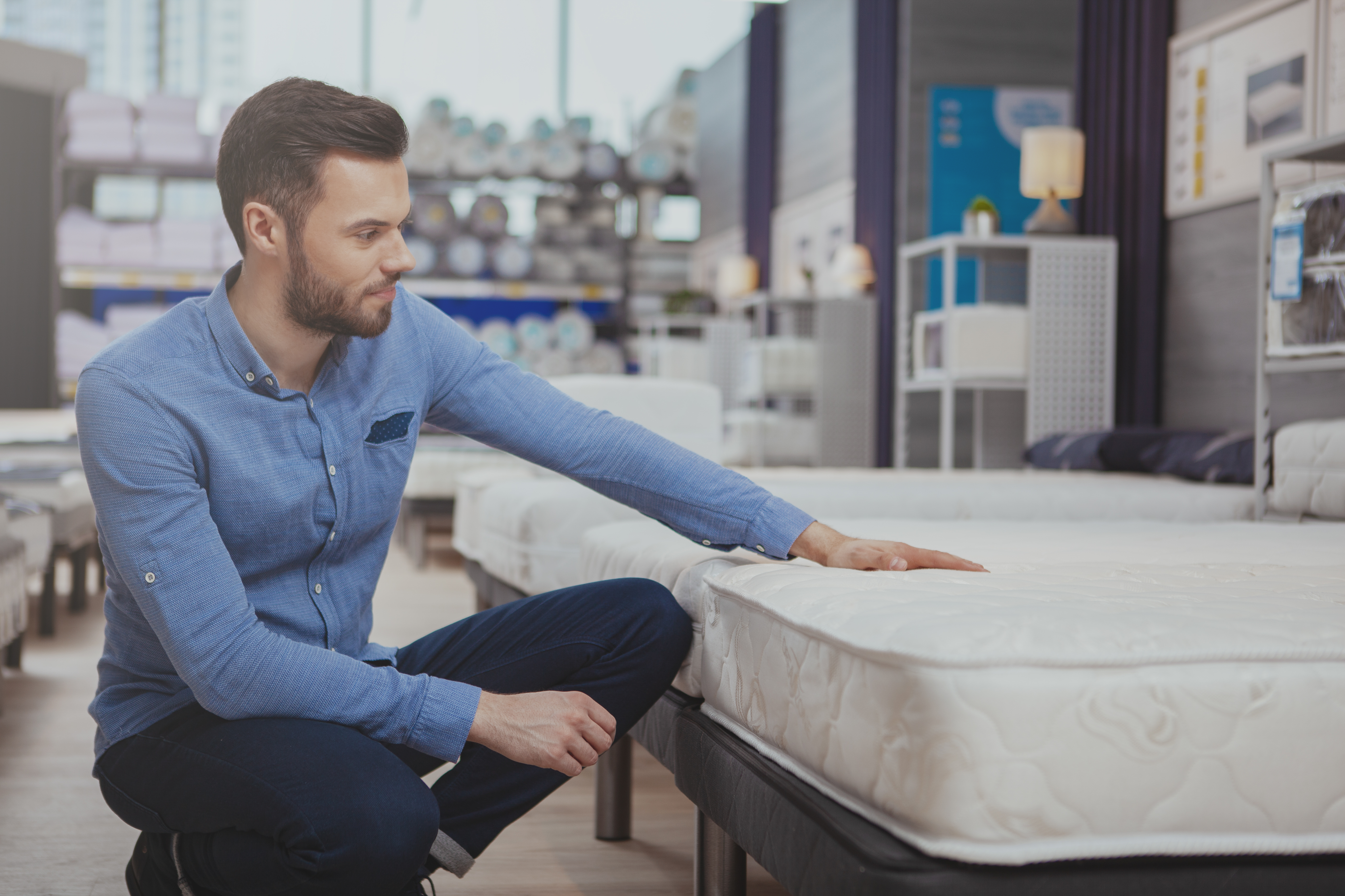 Man shopping for a mattress