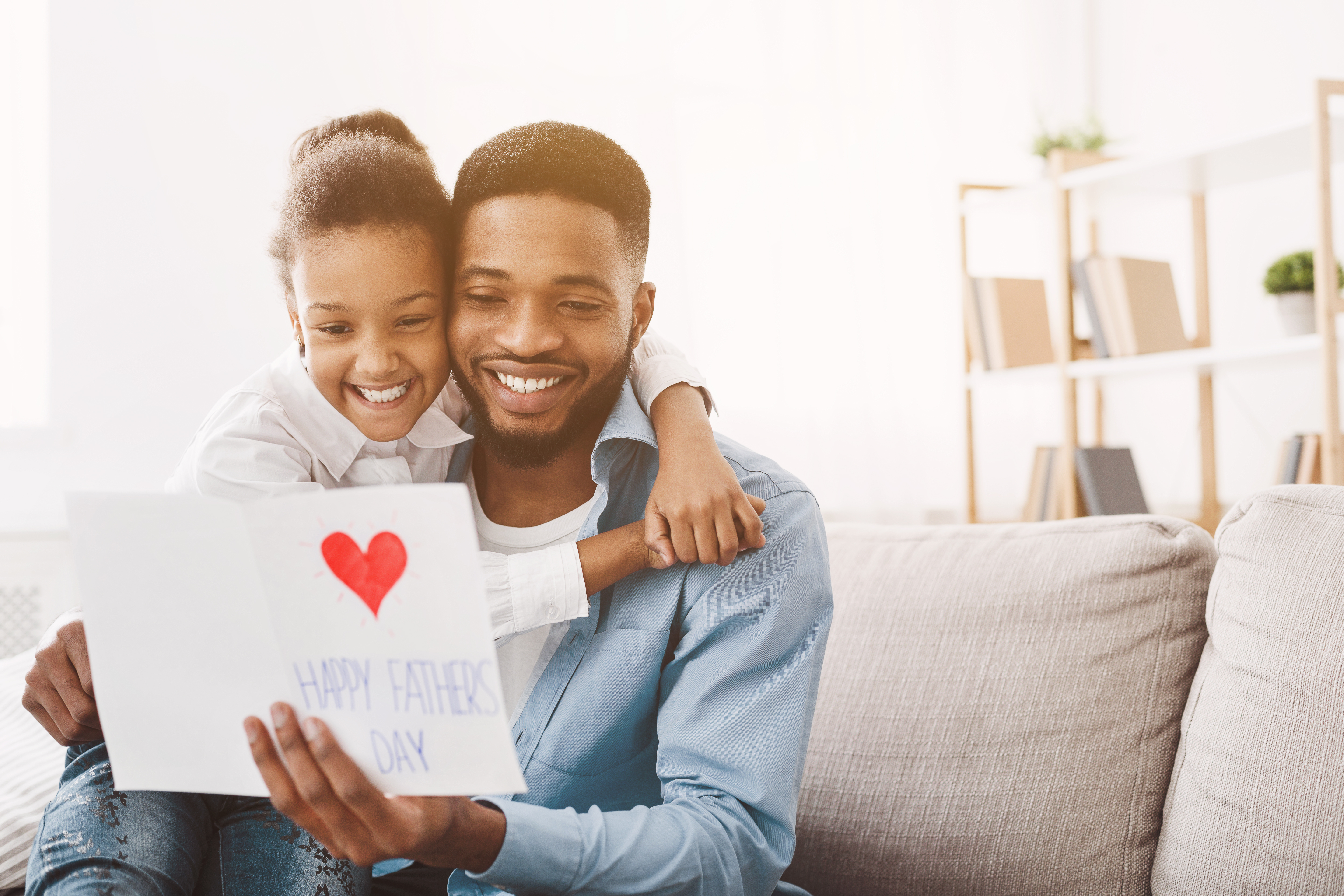 Daughter giving her father a gift