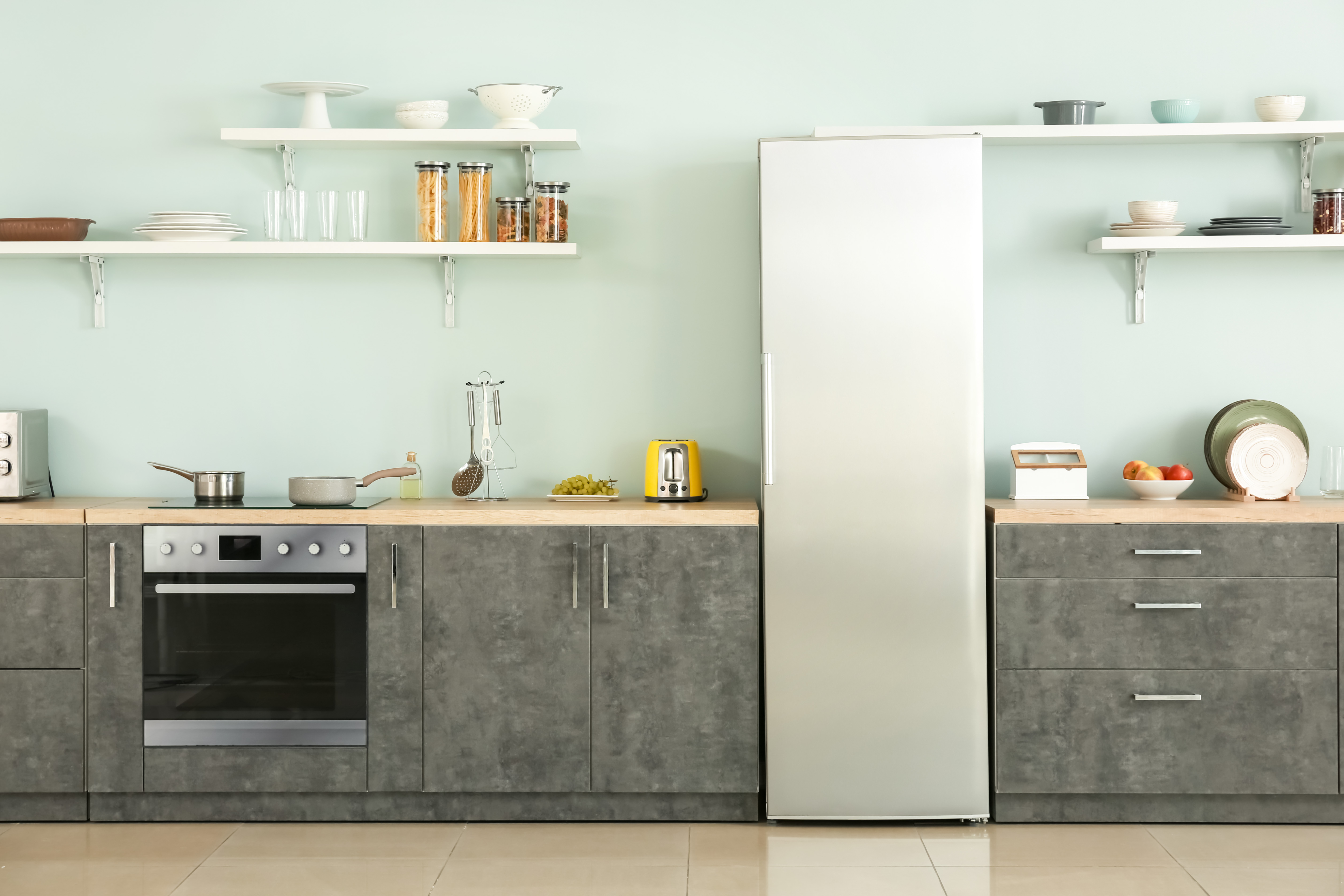 Kitchen with oven and refrigerator