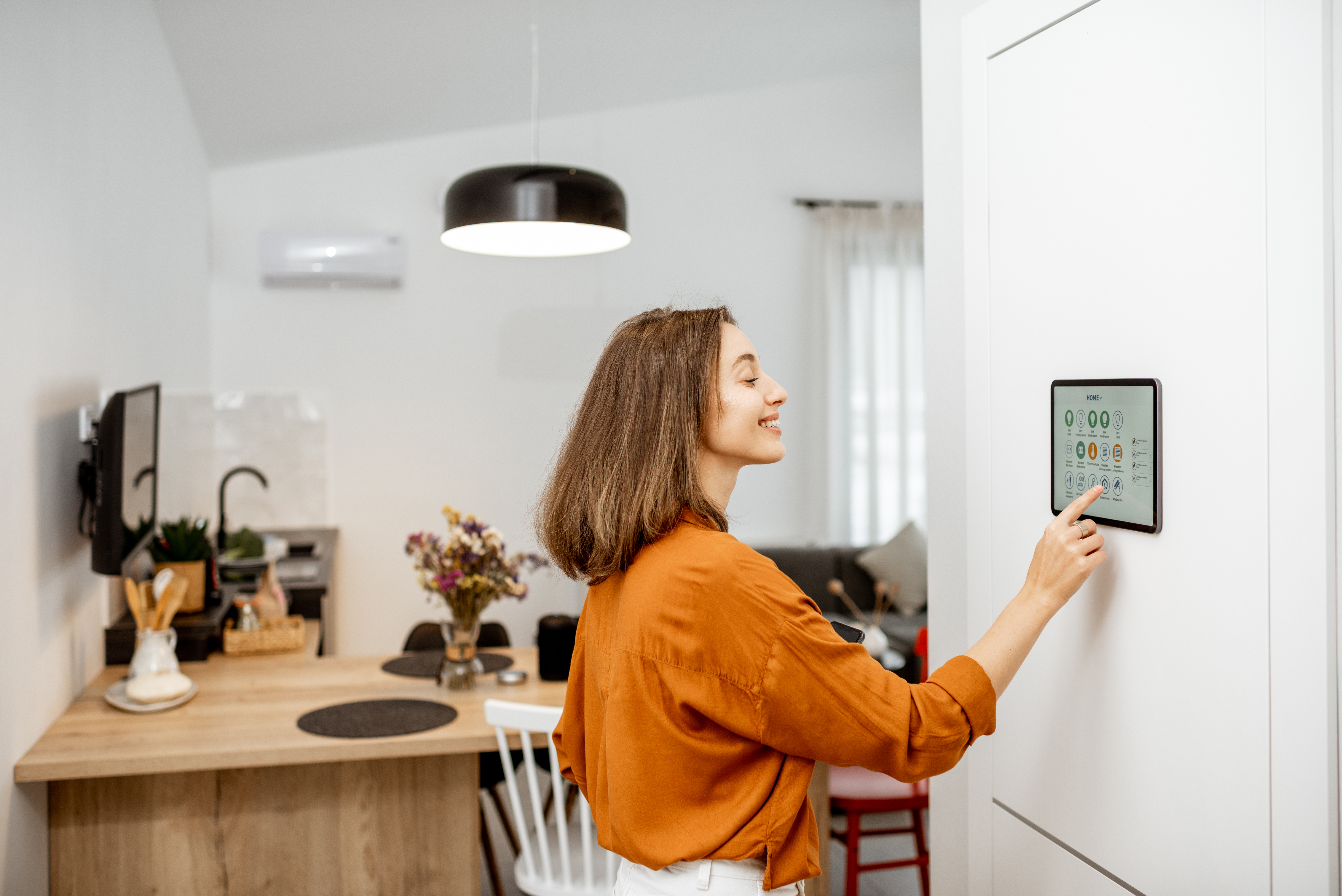 Woman using a smart home device