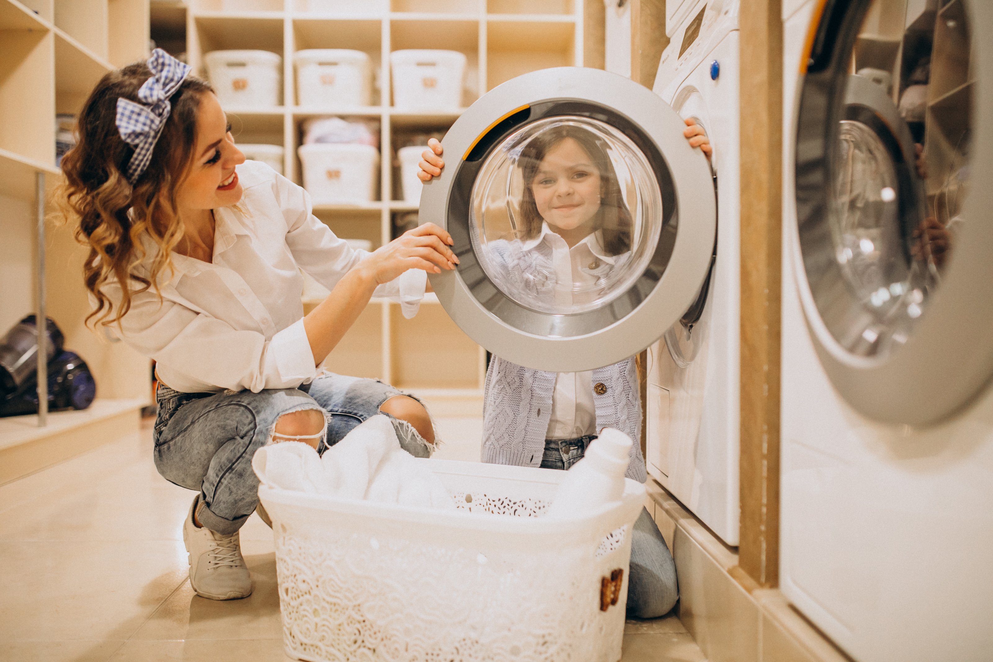 Mother and daughter doing laundry together