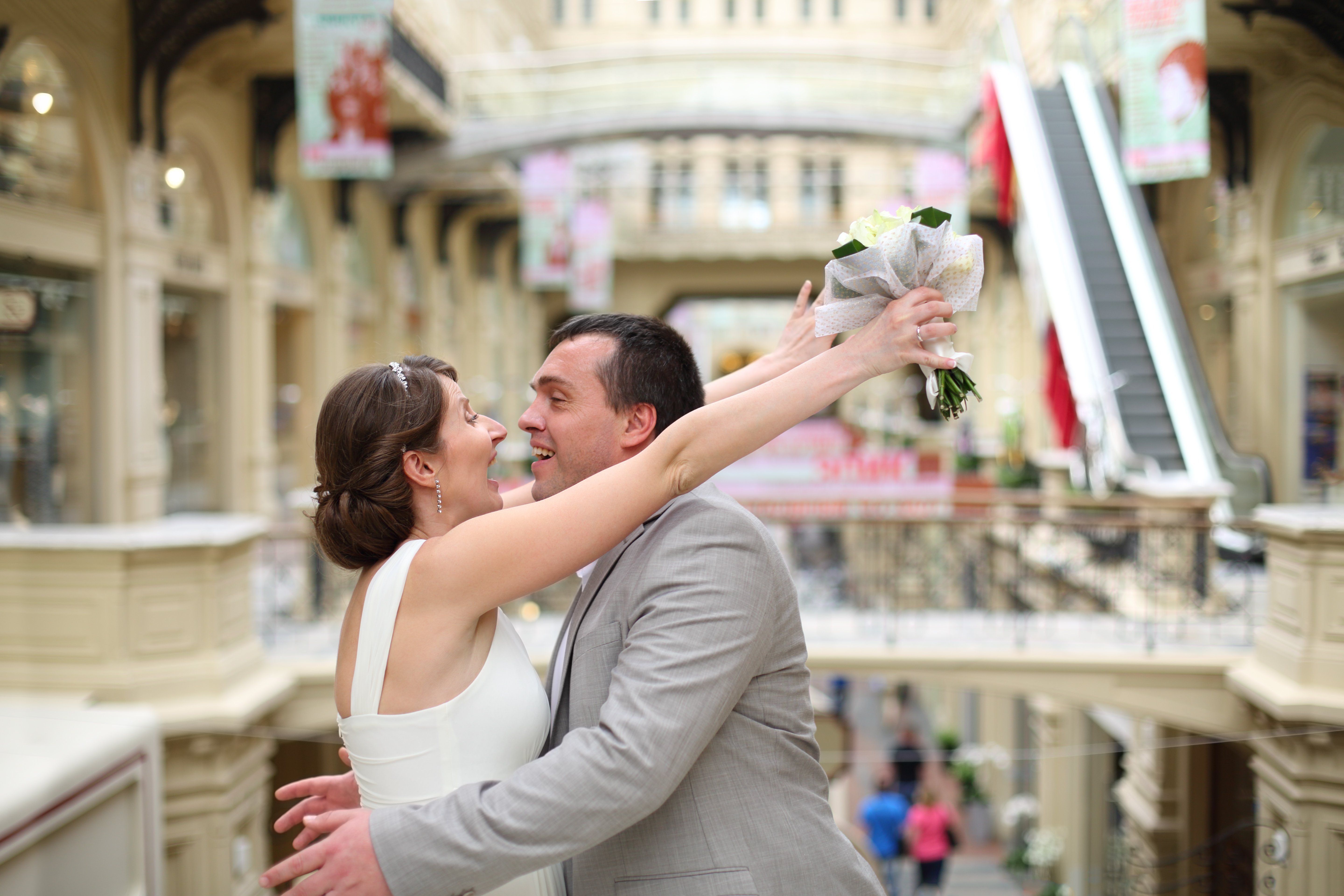 Man and woman hugging after getting married