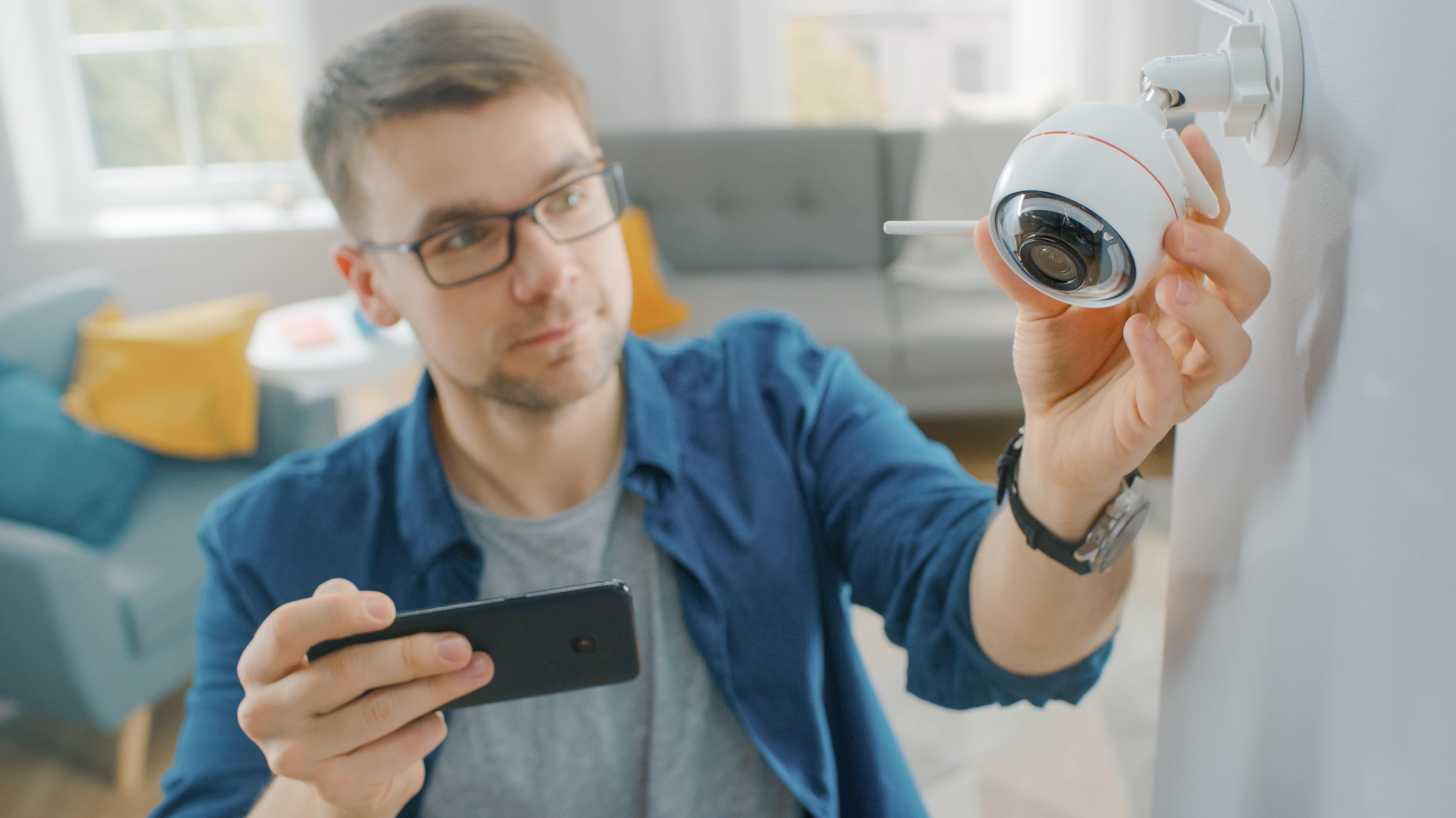 Man using home security camera