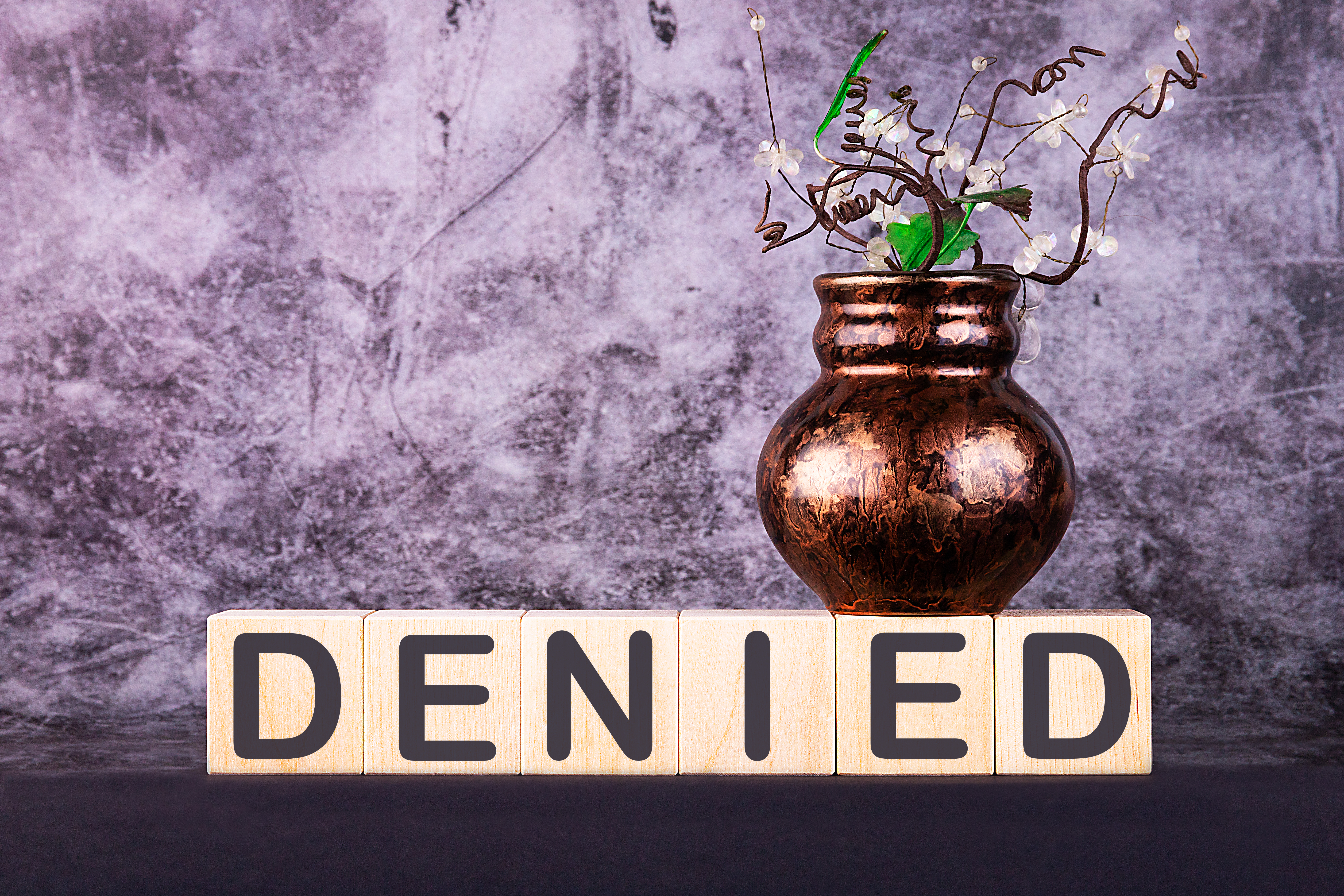 blocks that spell the word denied