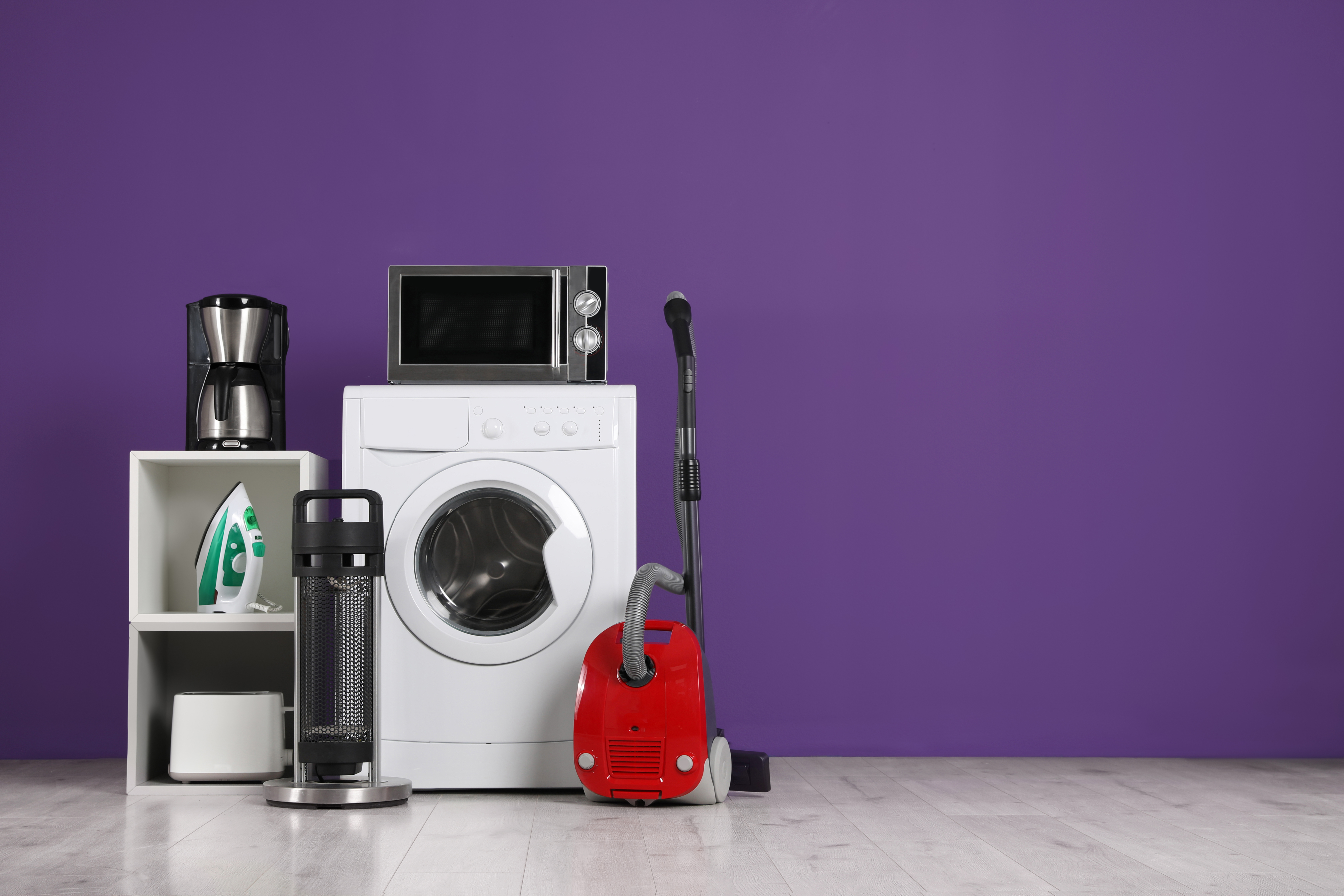 Set of appliances against a colored background