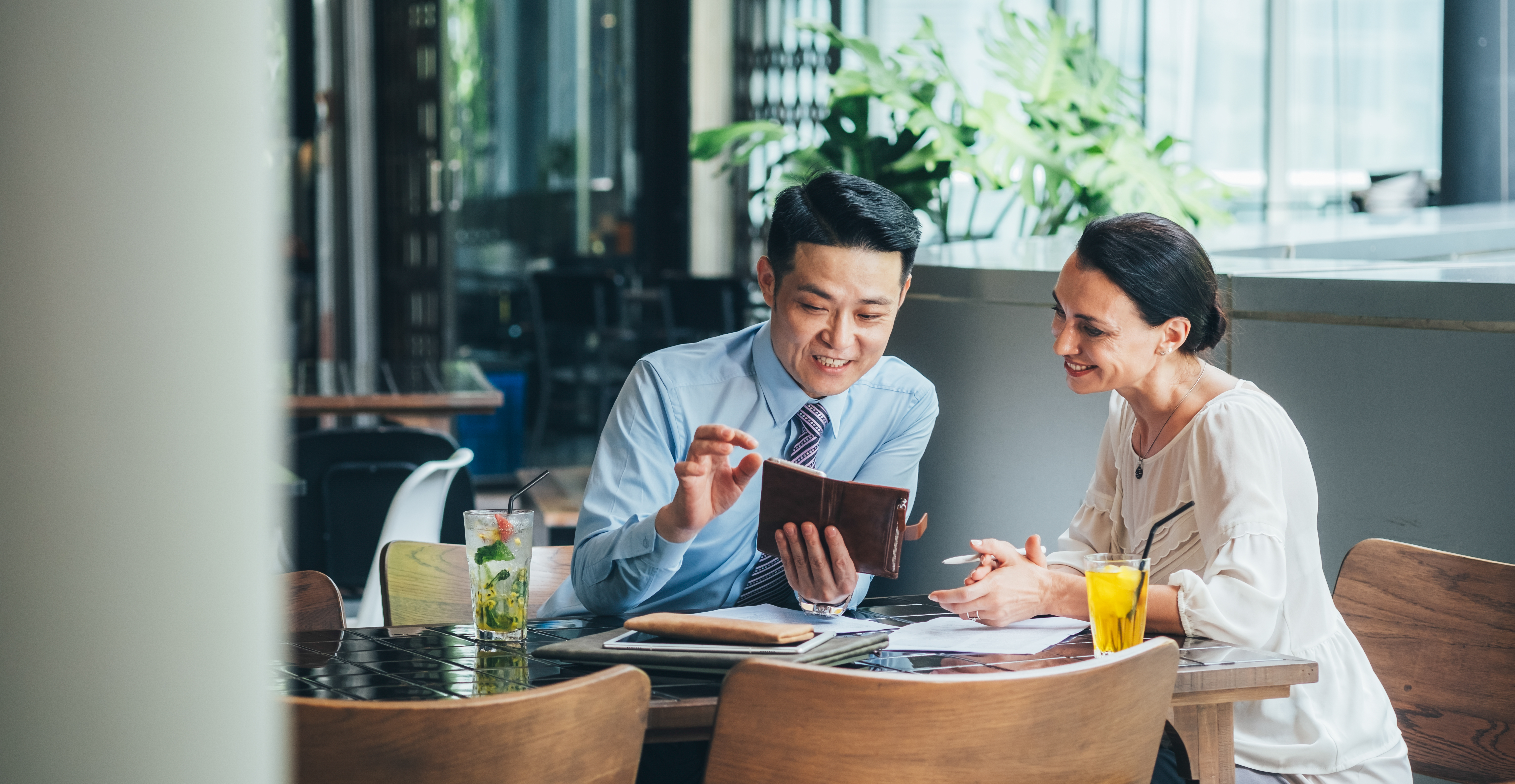 Man and woman looking at a tablet together