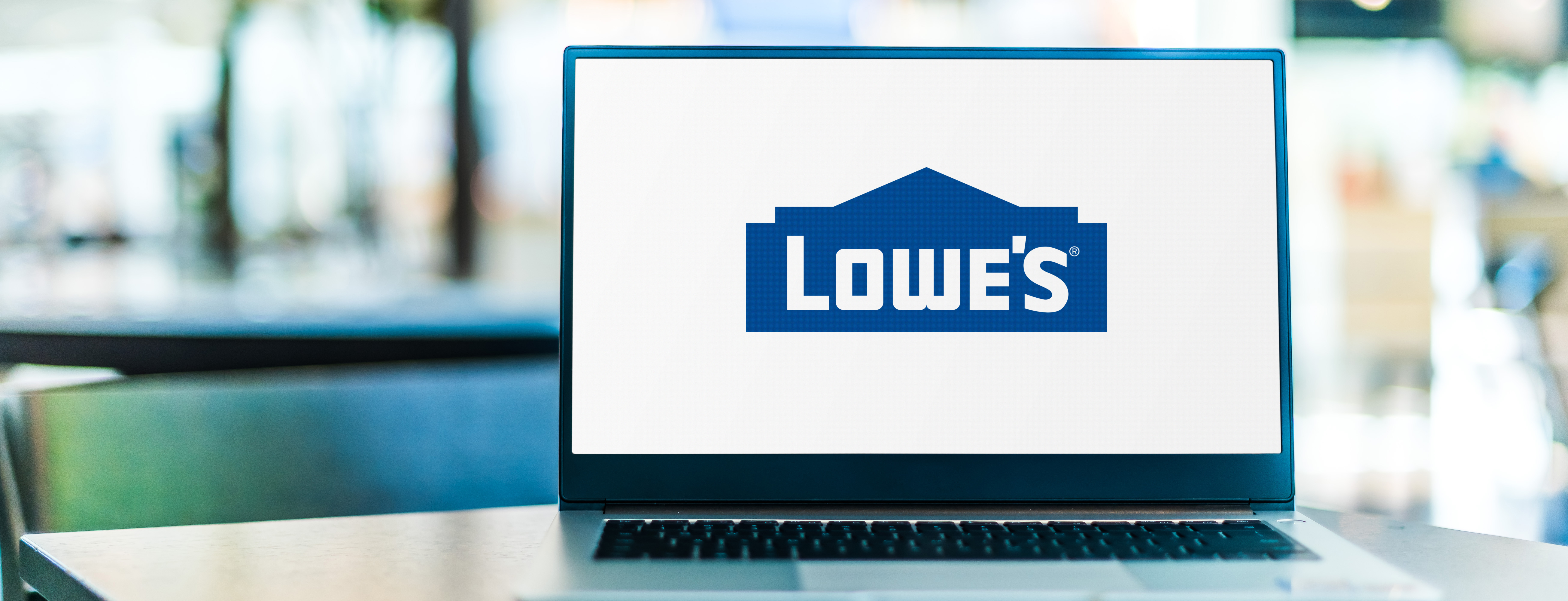 Laptop open with the Lowe's logo on it