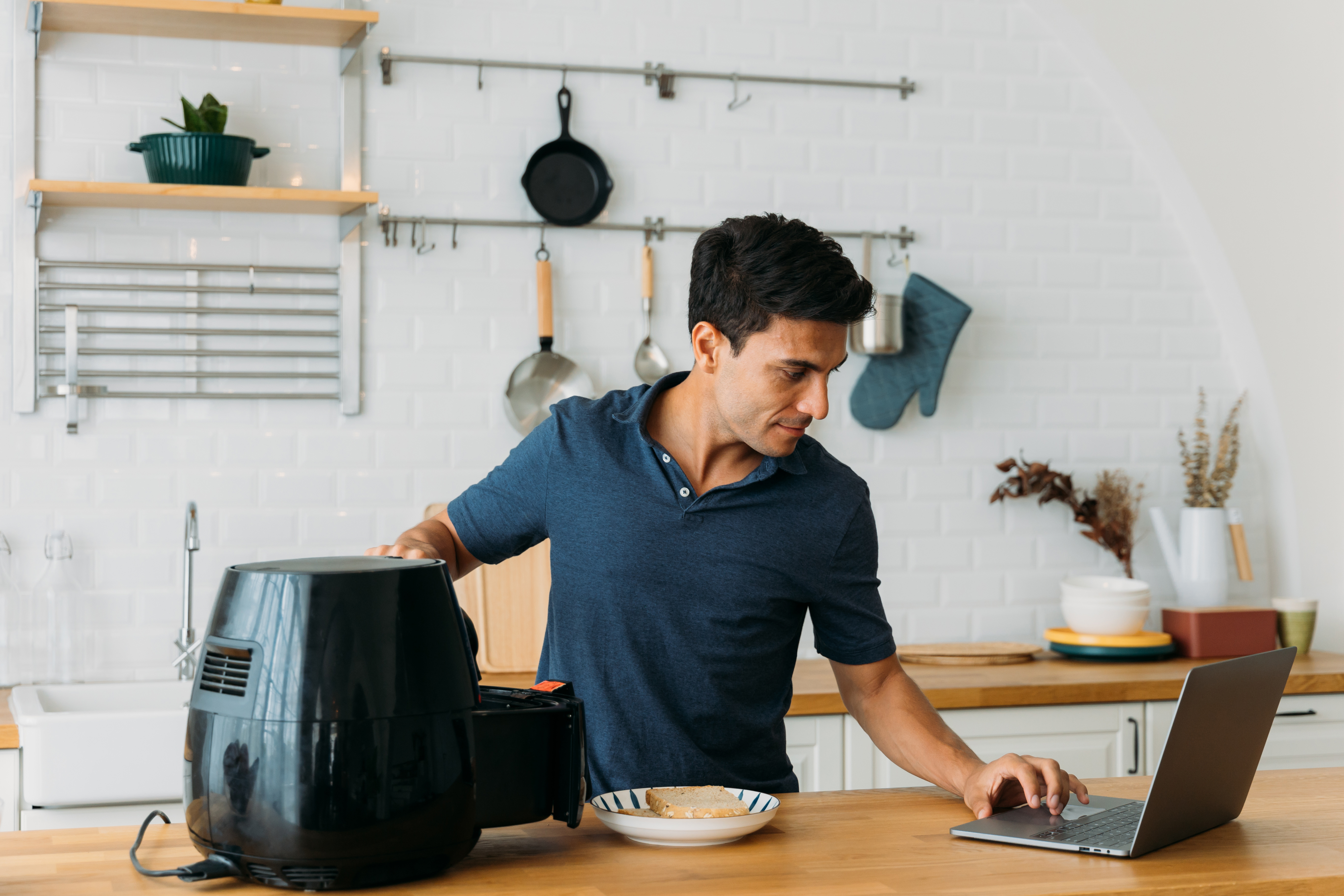 Man using an air fryer