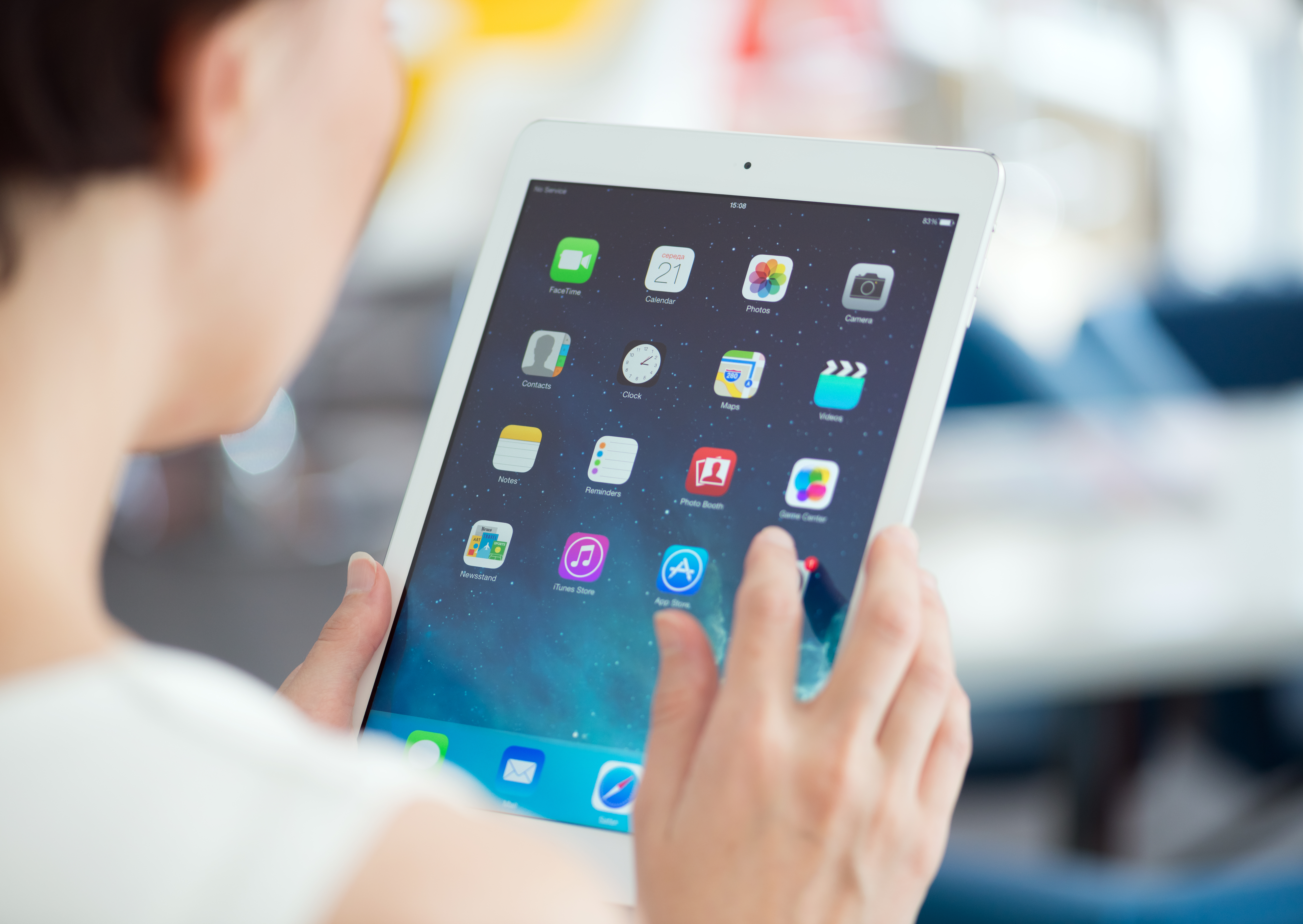 Woman holding a white iPad