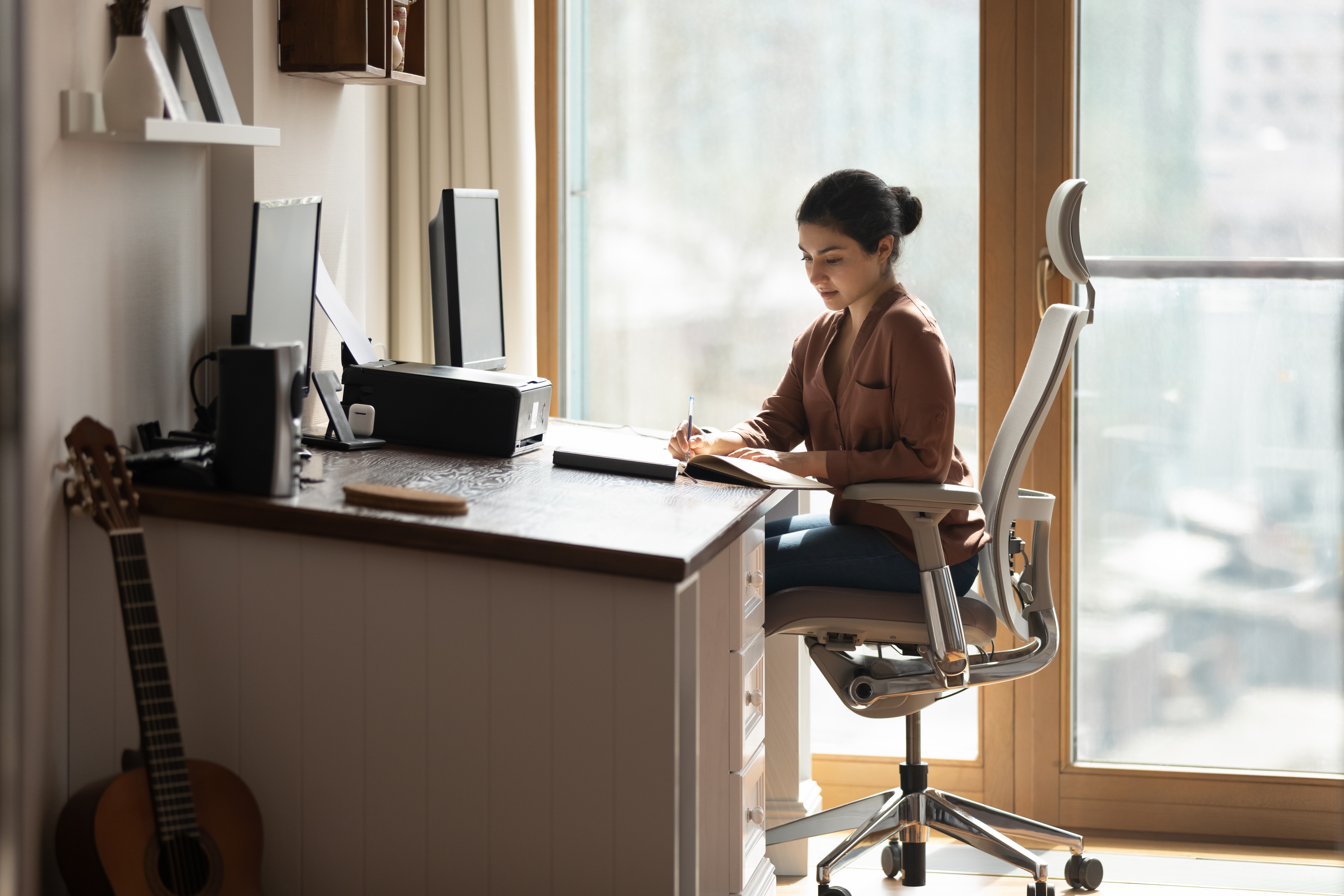 Woman sitting in desk chair