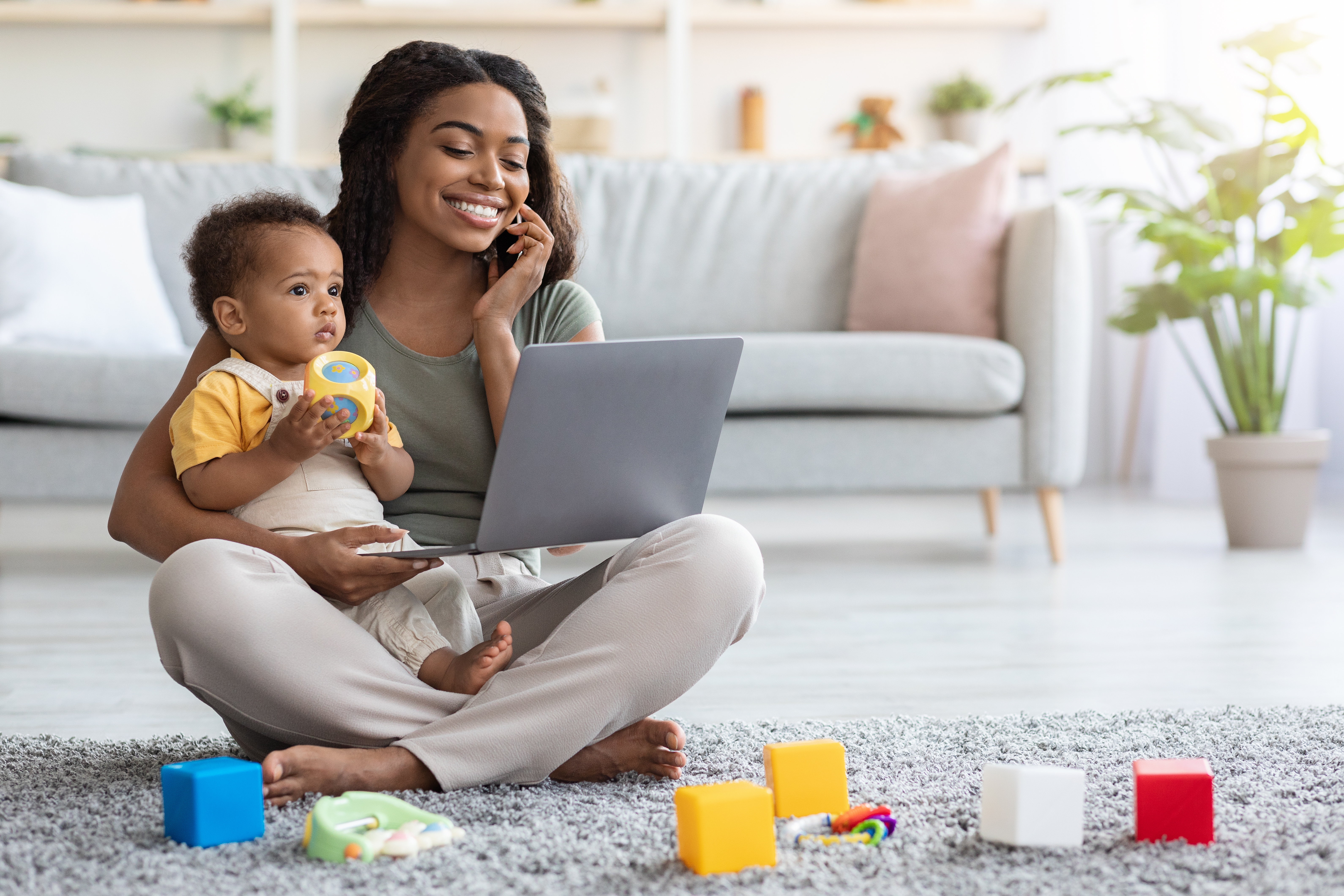 Woman with baby talking on phone