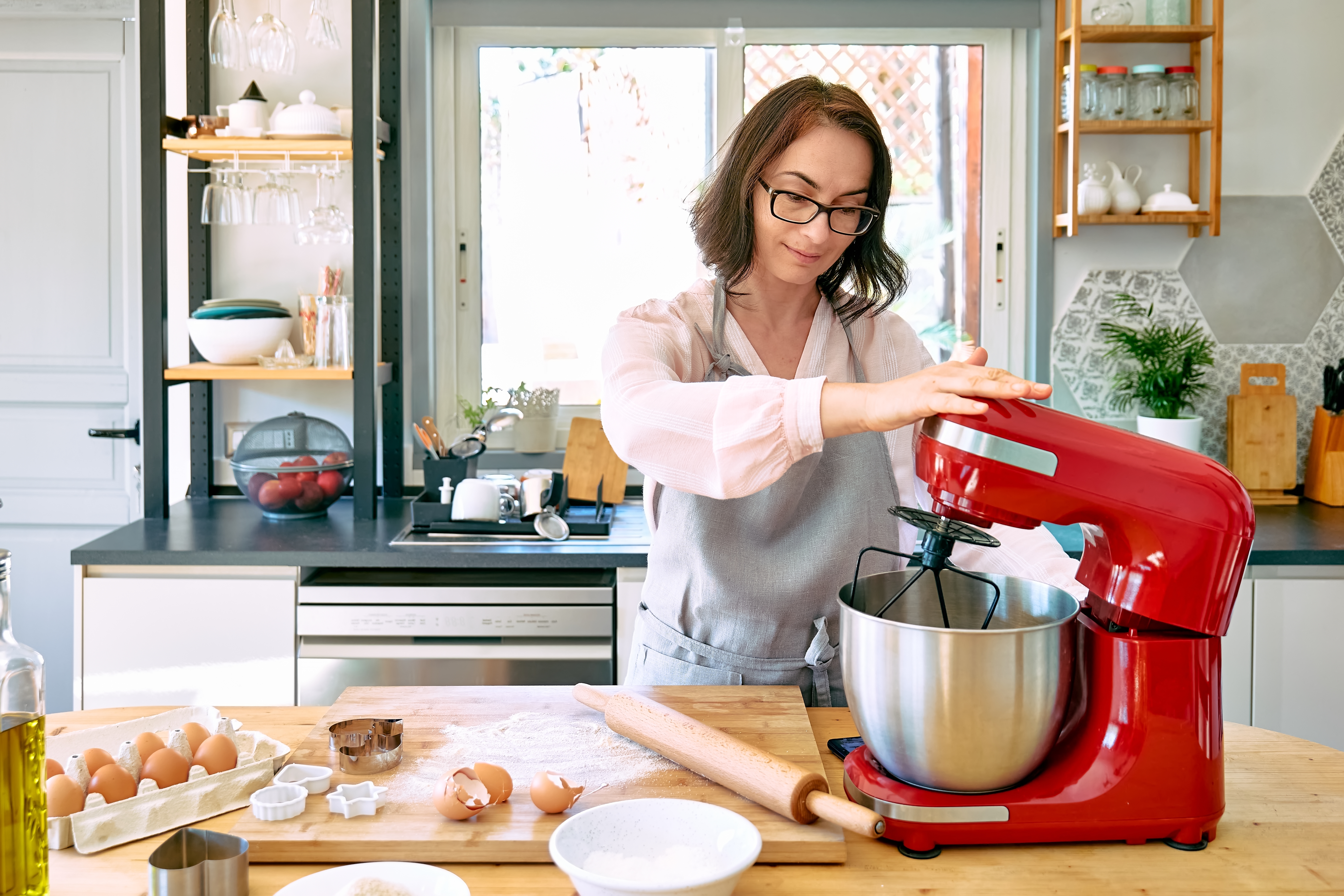 Woman using stand mixer
