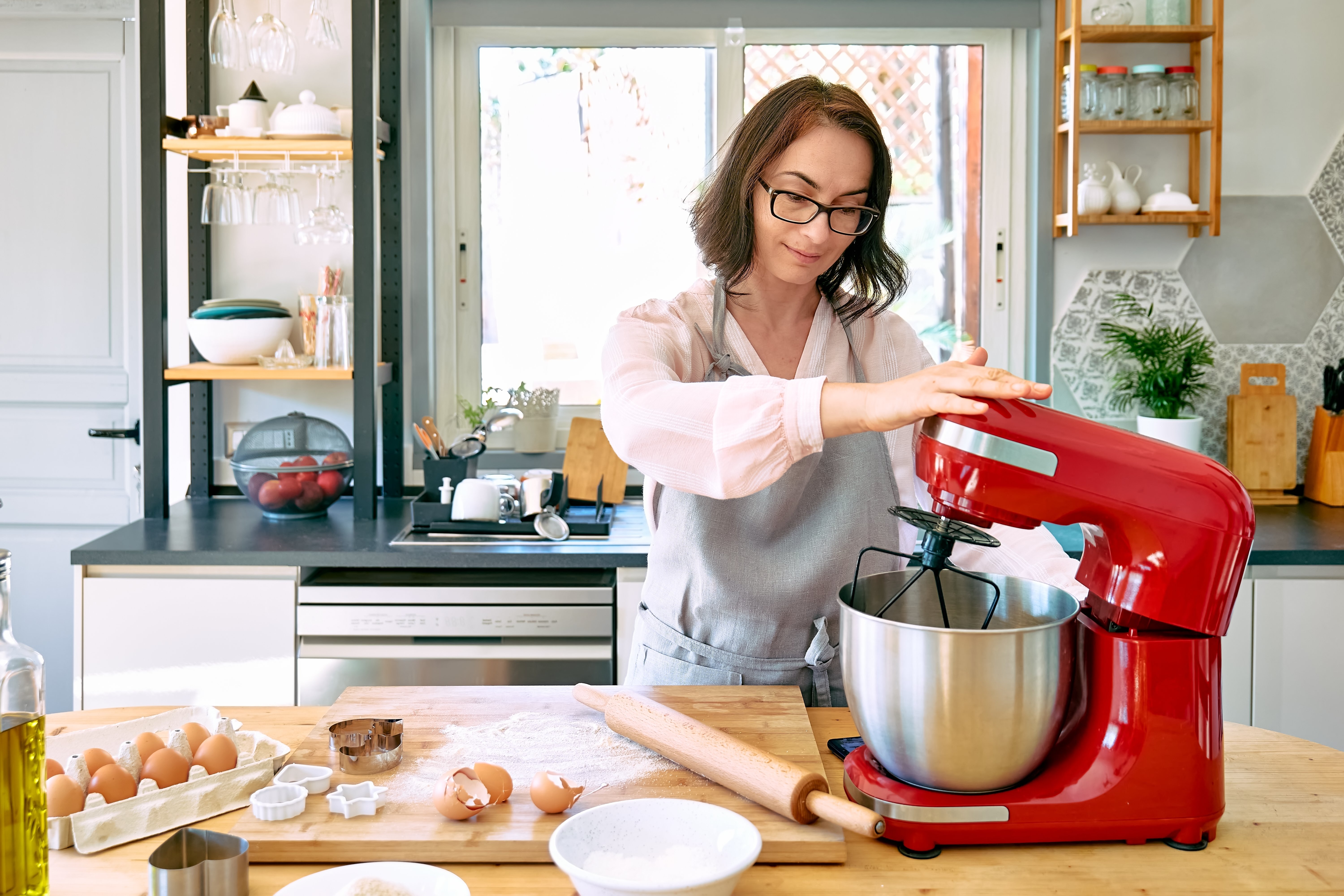 Woman using stand mixer