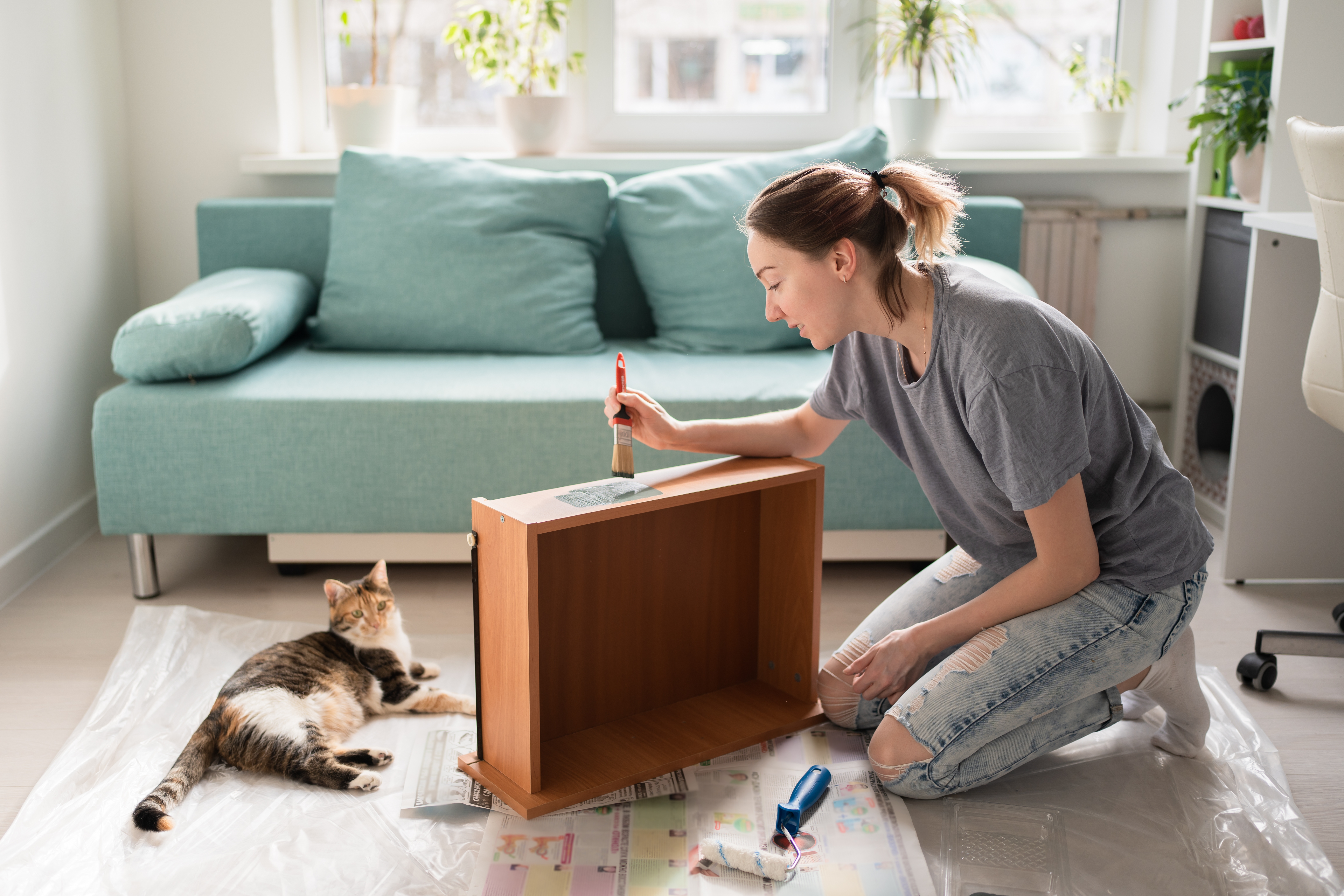 Woman painting a drawer