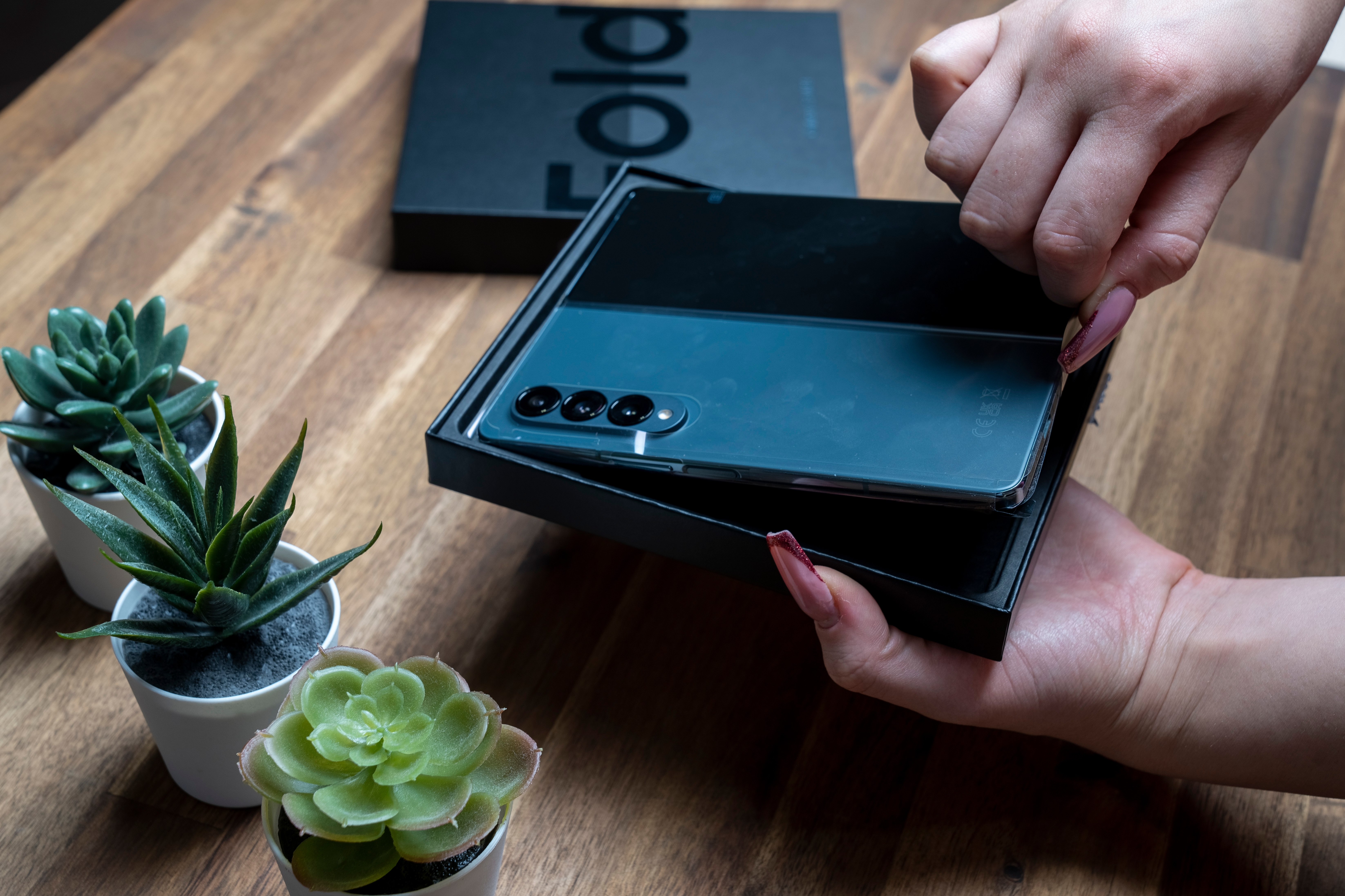Person taking a Samsung Galaxy Z Fold 4 out of its box