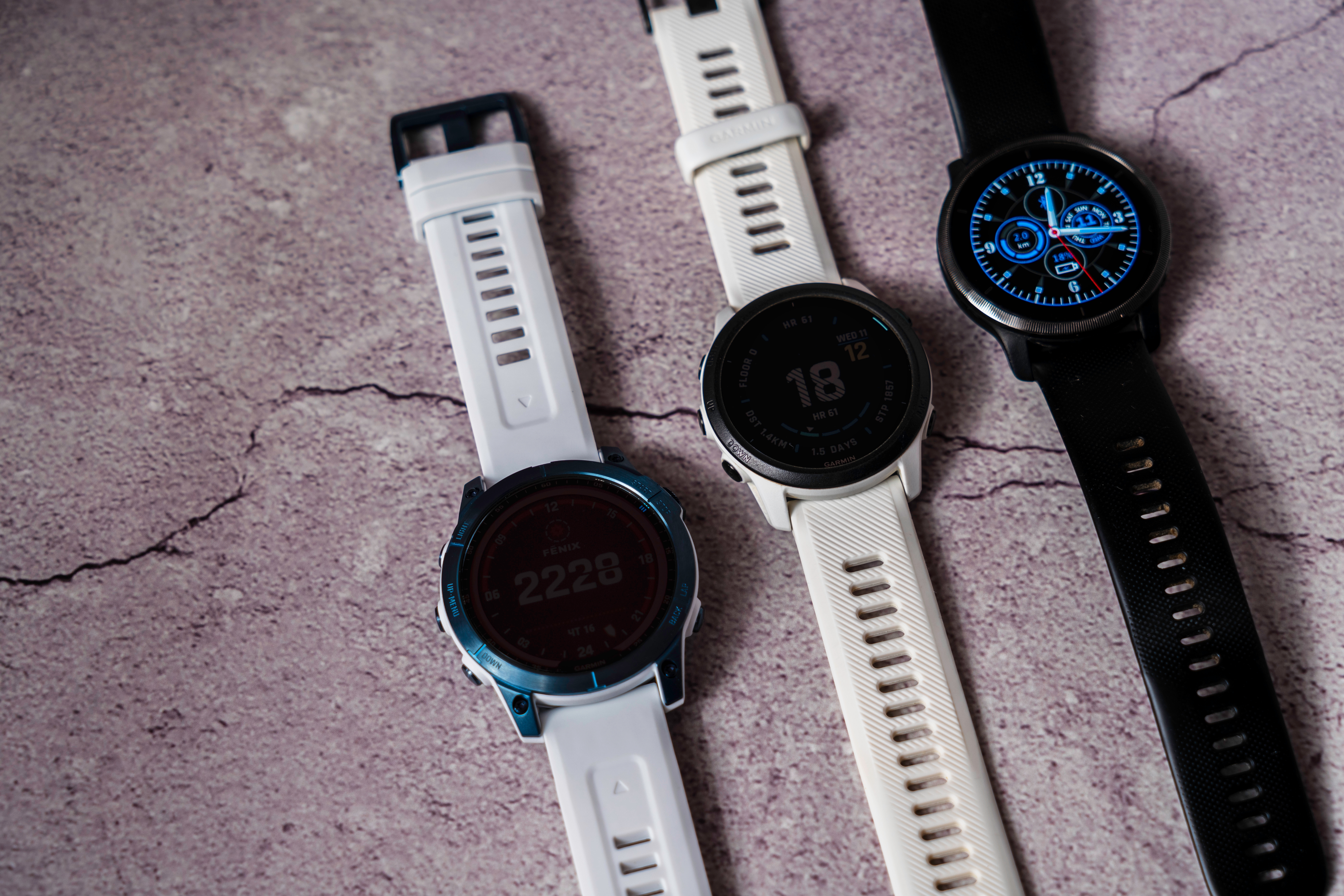 Three smartwatches lined up next to one another