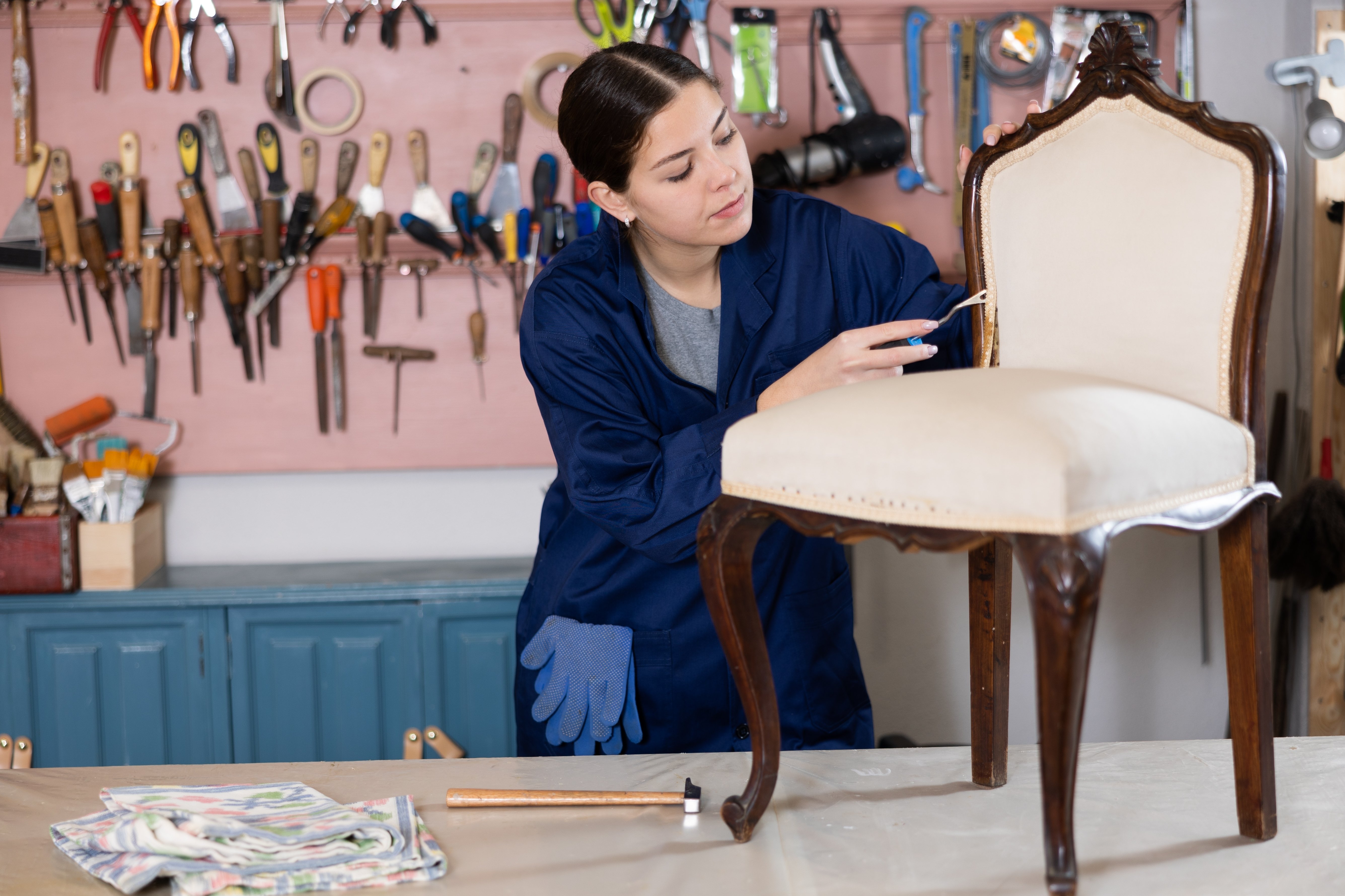 Woman repairing a chair