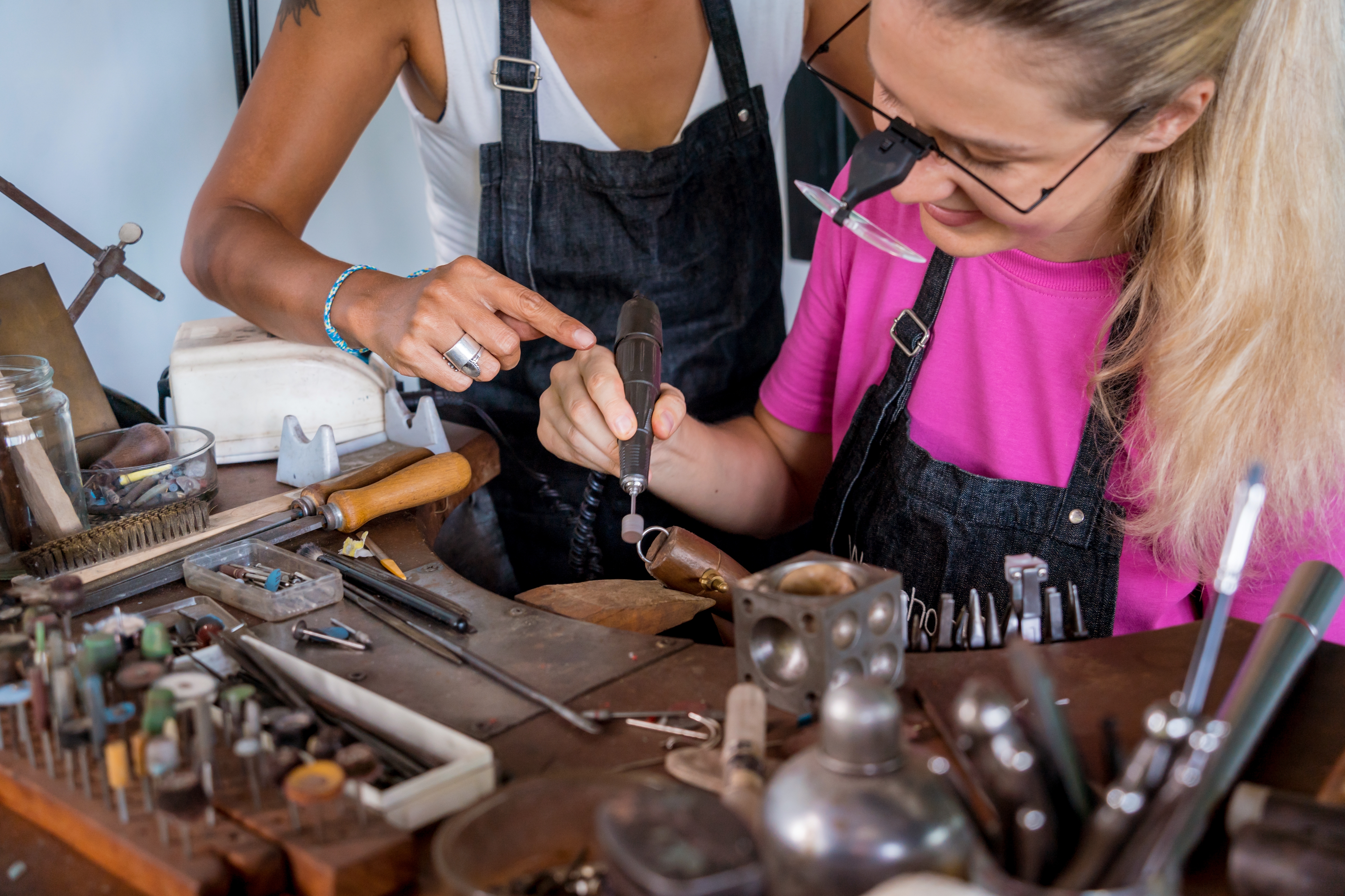 Two women polishing a ring