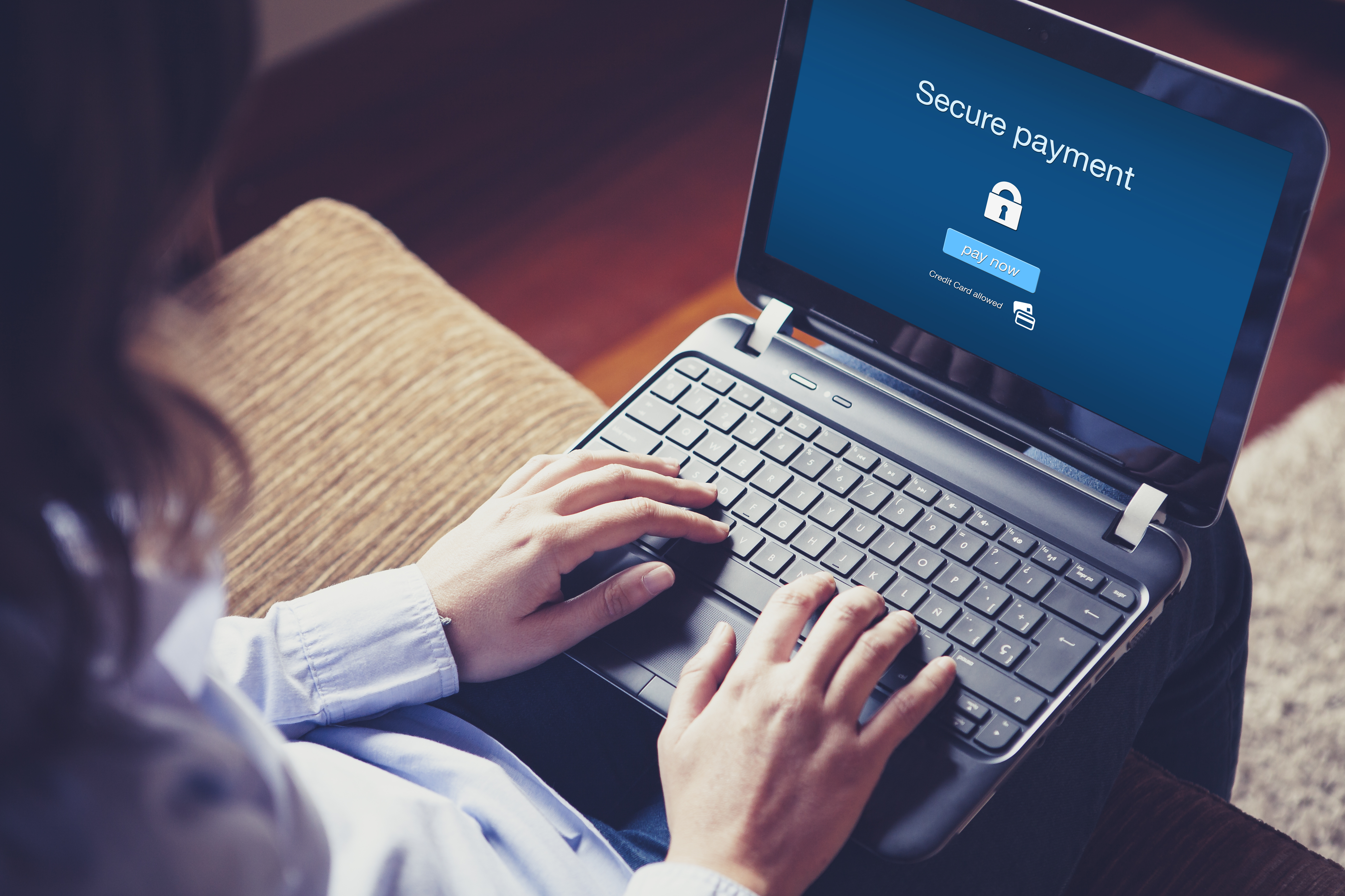 Woman securely shopping on her laptop