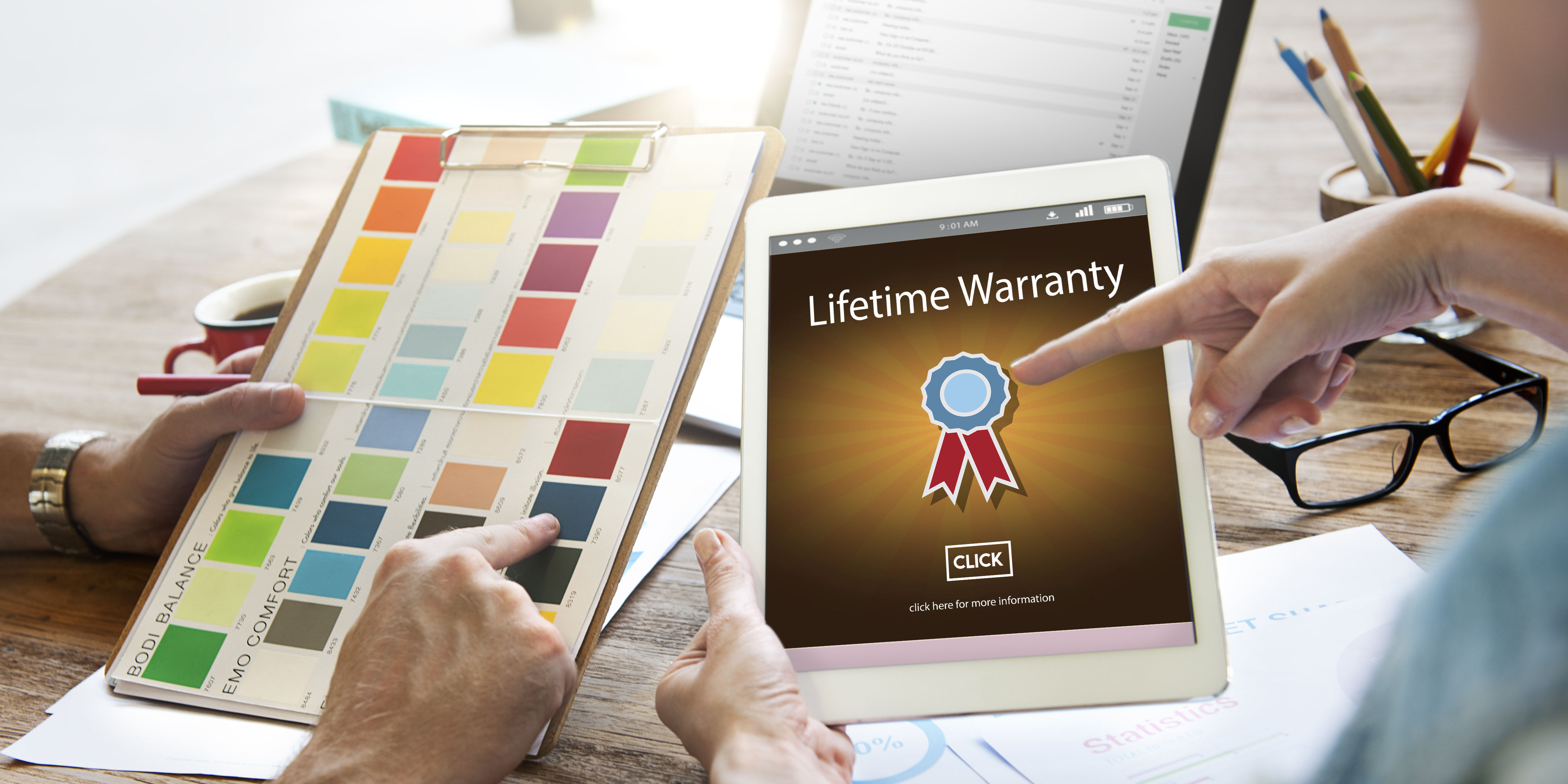 Person pointing to a tablet that has an image of a lifetime warranty on it