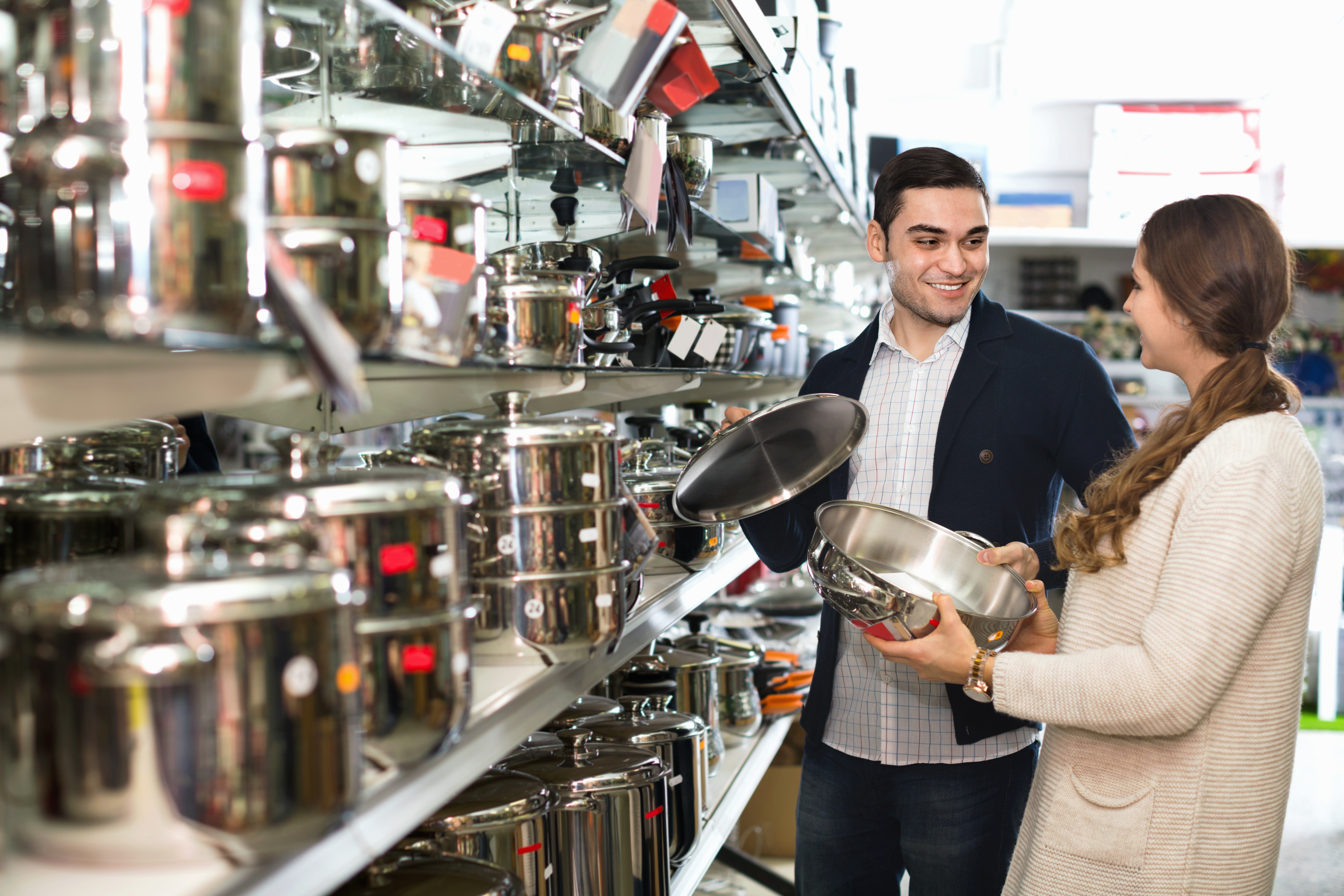 Man and woman shopping for cookware together