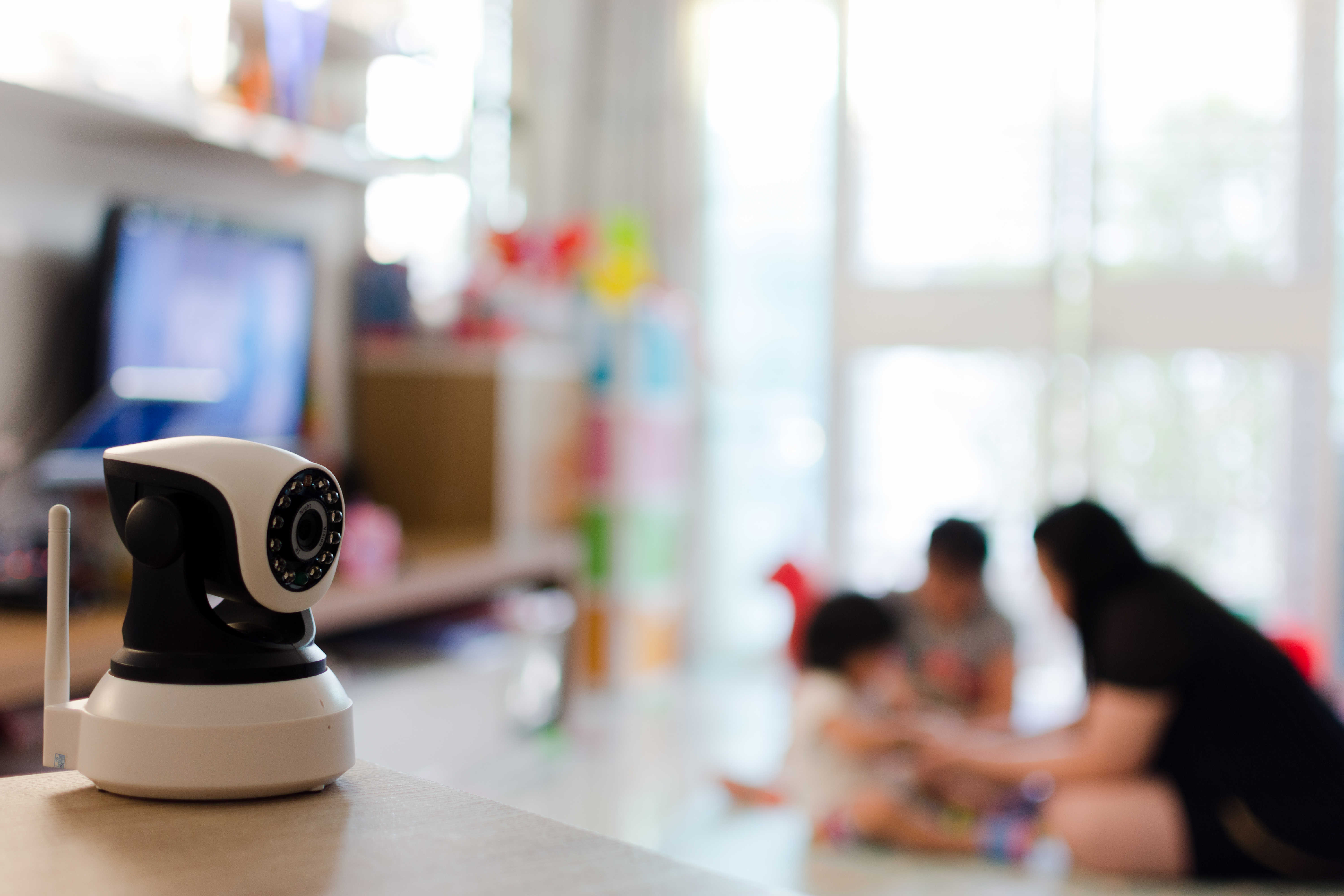 Indoor security camera watching kids playing
