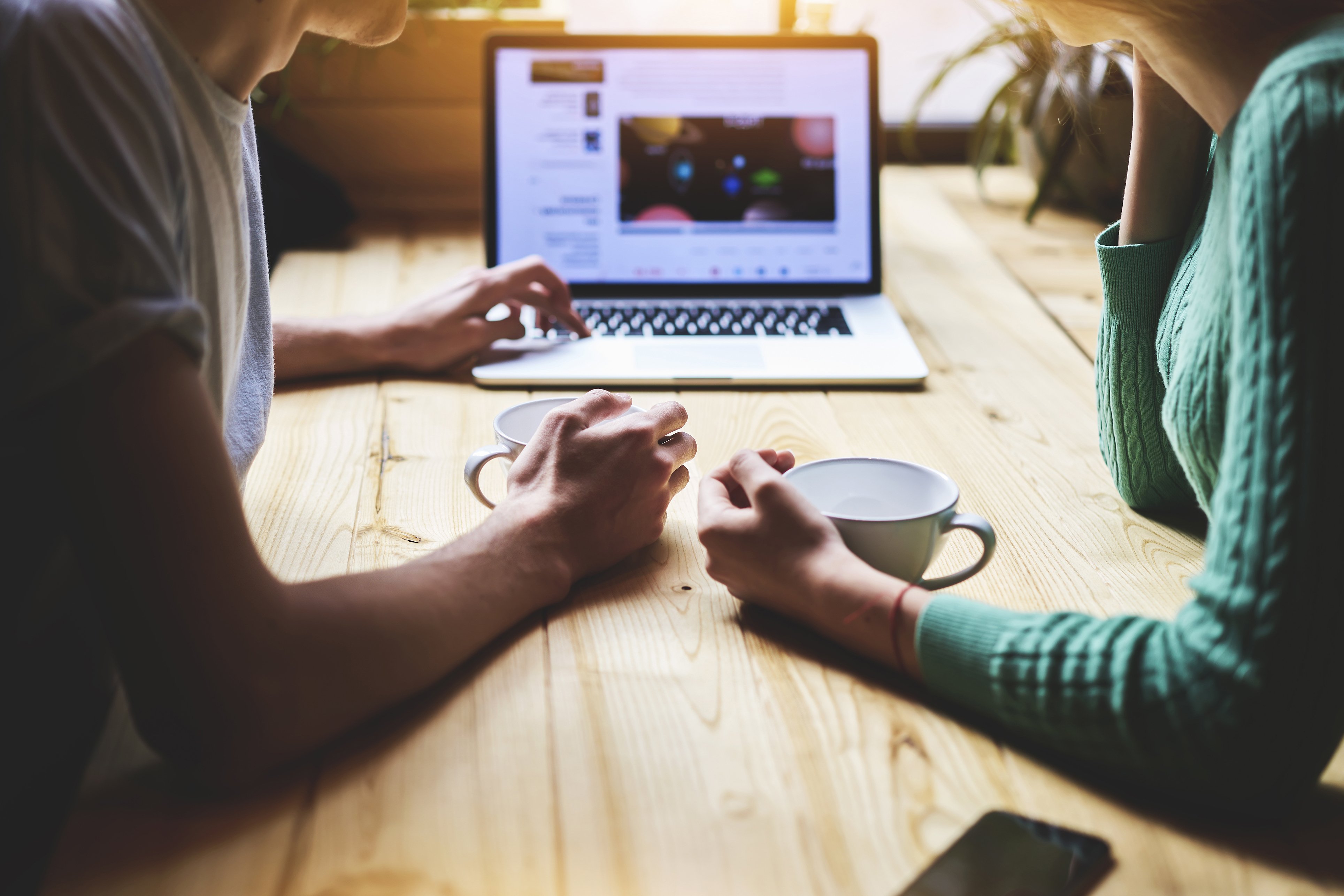 two people shopping for a tv online