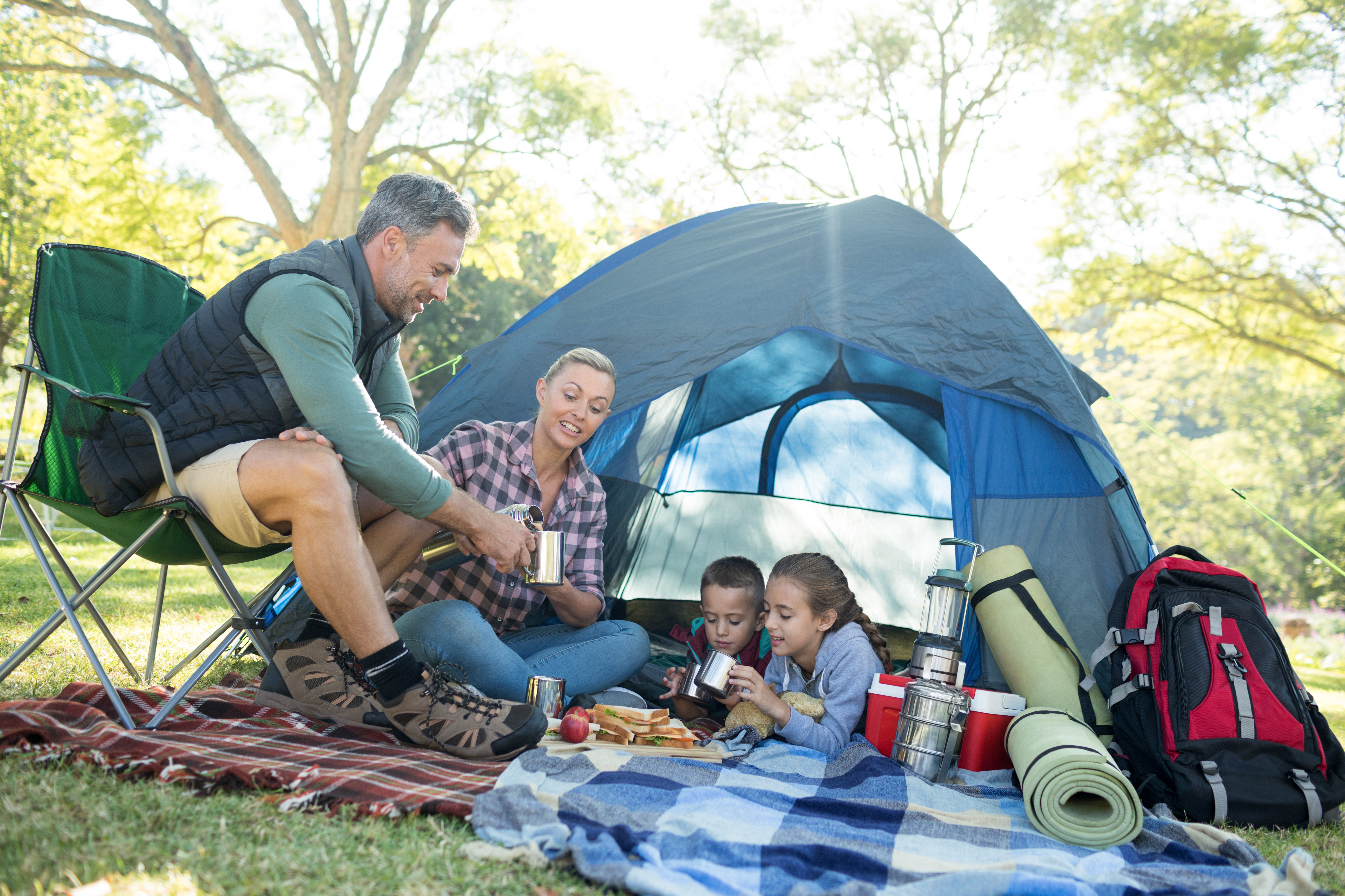 Family camping together in a tent