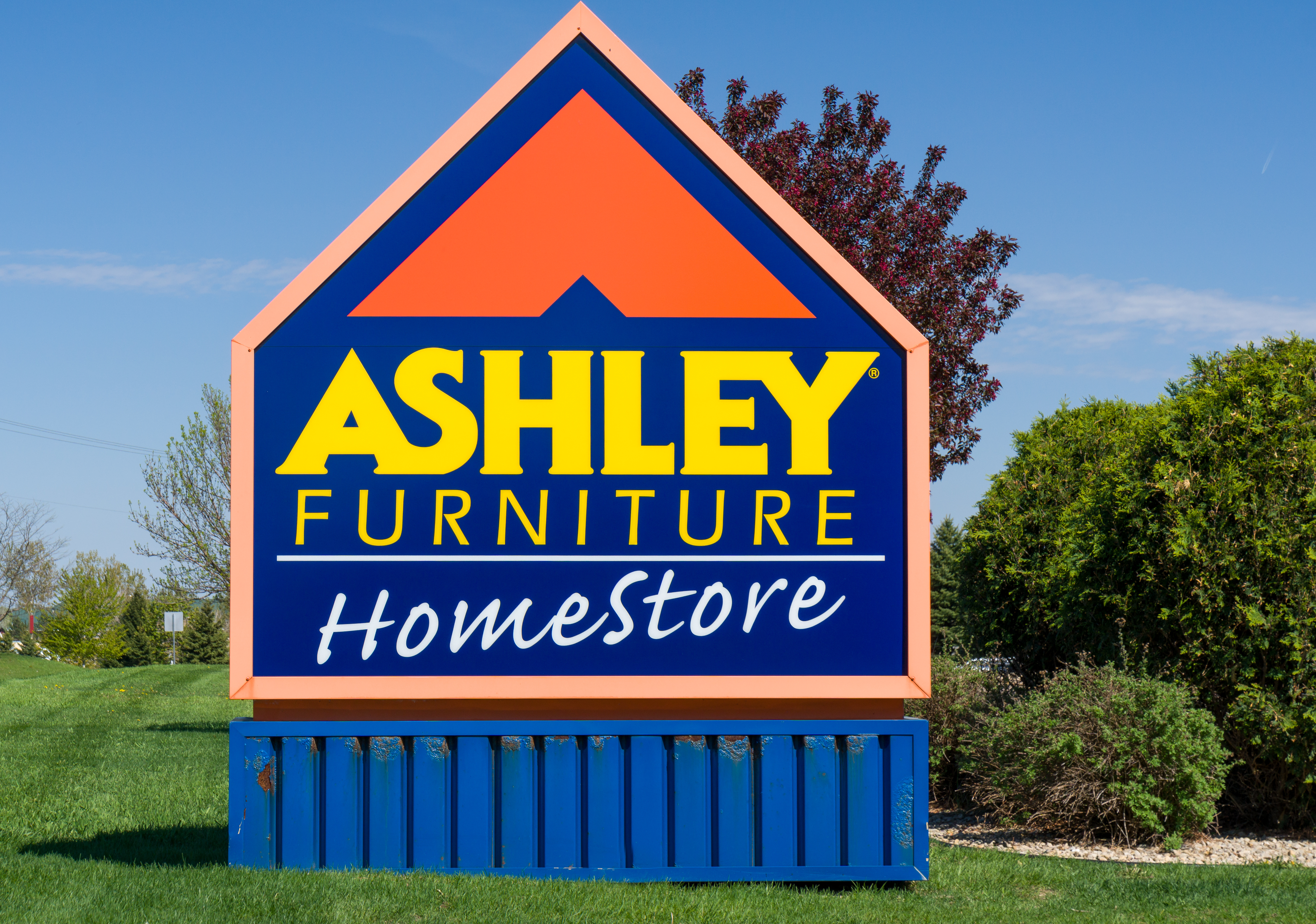 Sign with the Ashley Furniture HomeStore logo on it
