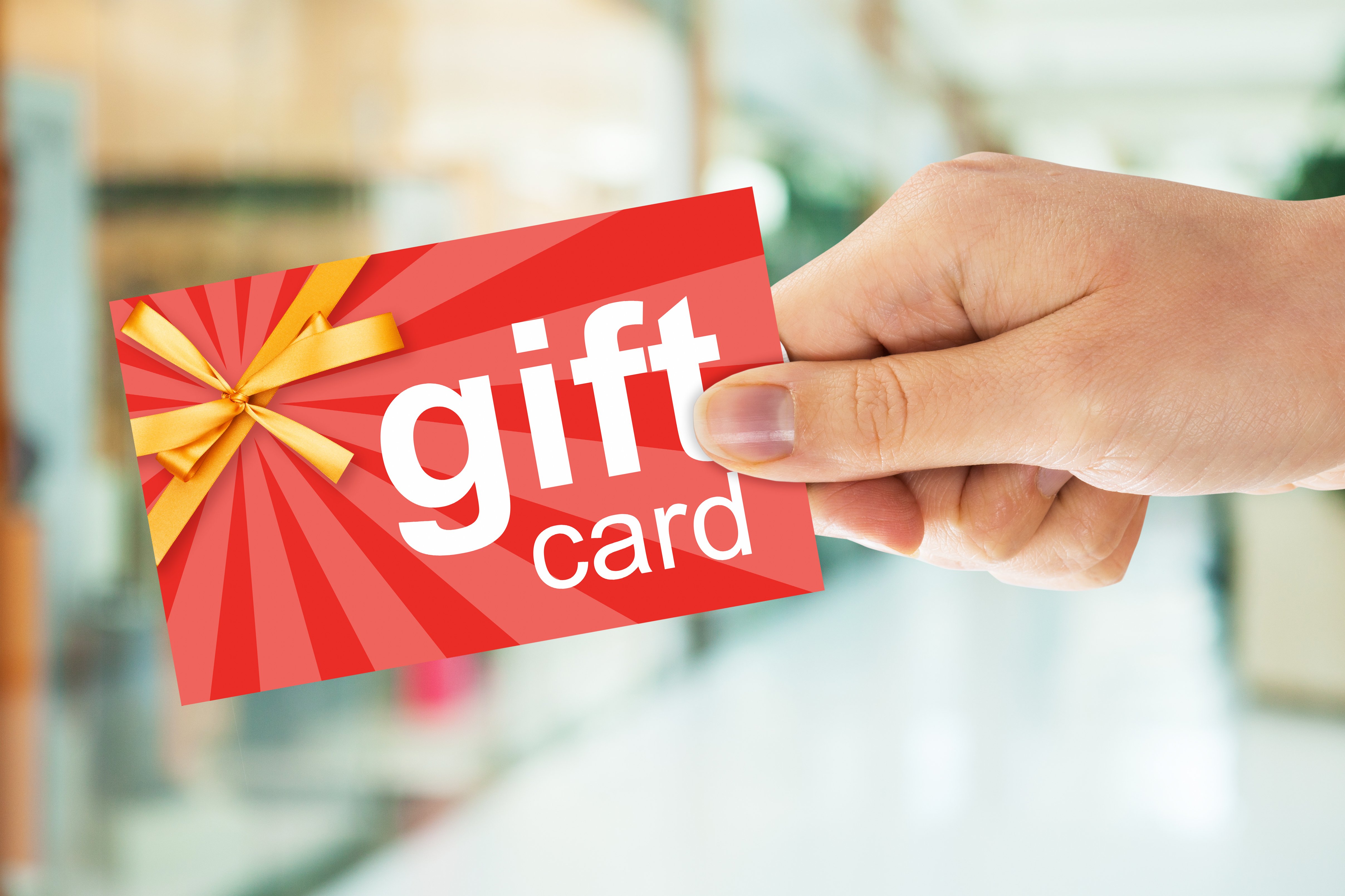 Person holding a gift card