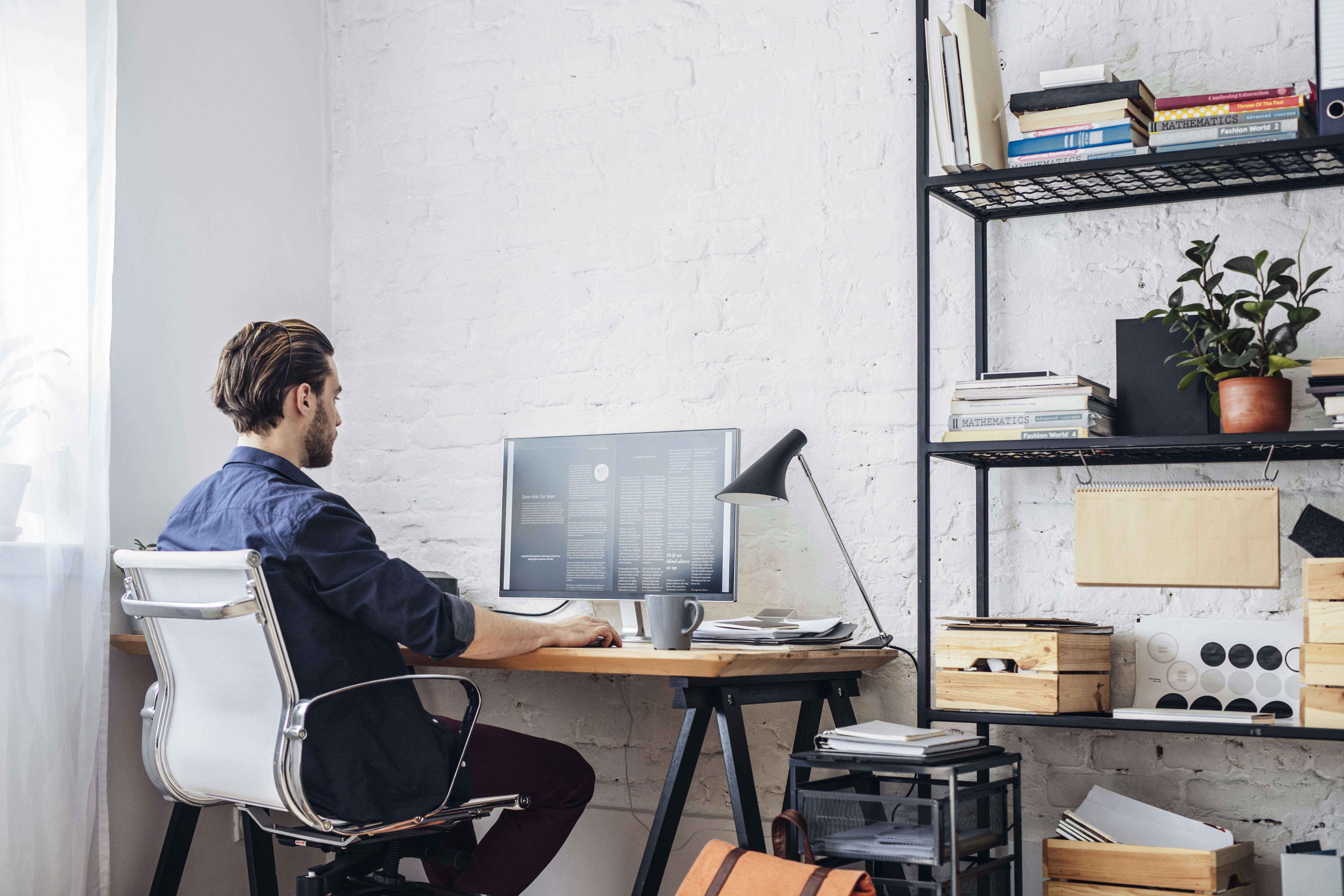 person working at a home desk